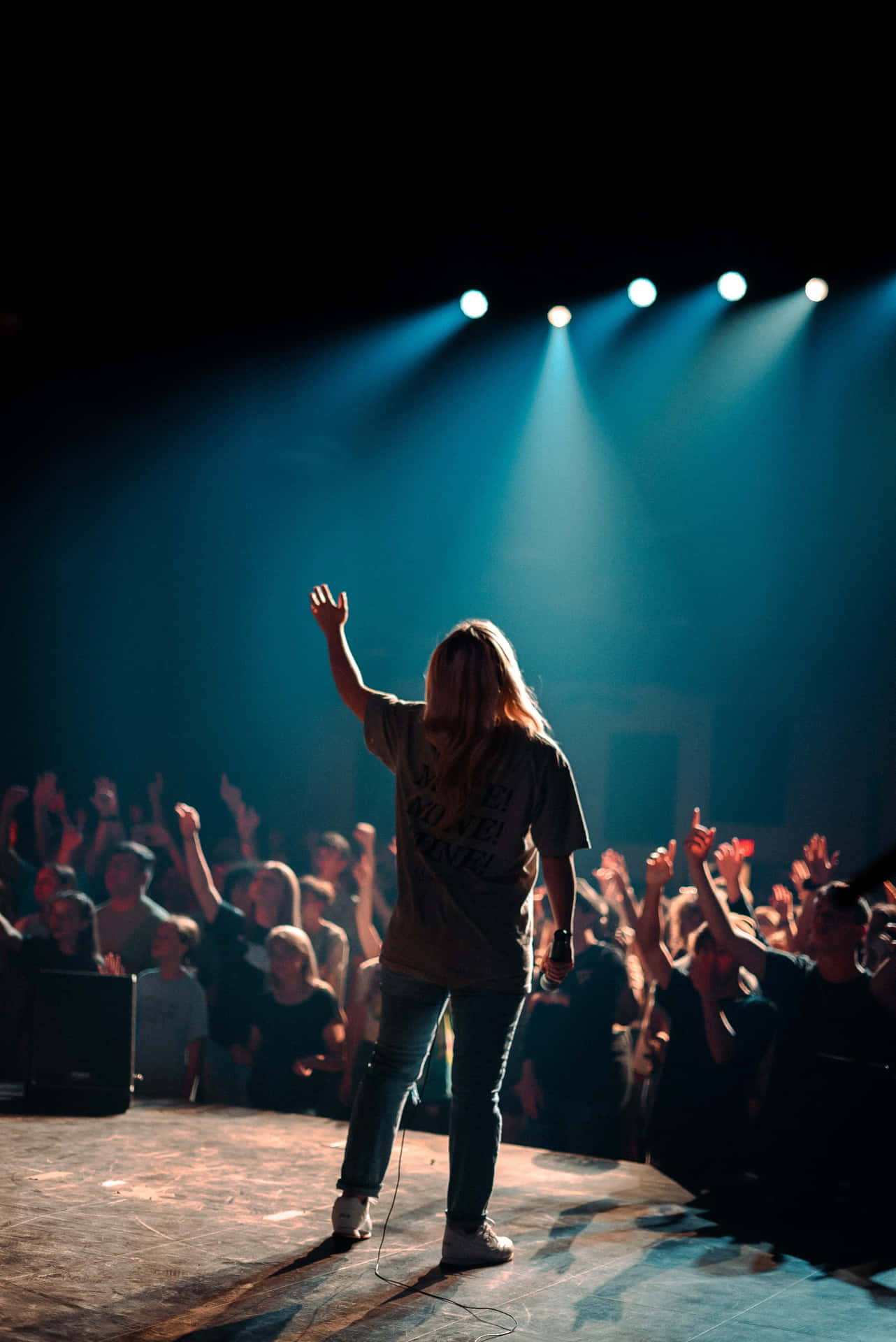 Worship_ Leader_ Raising_ Hand_in_ Concert Wallpaper