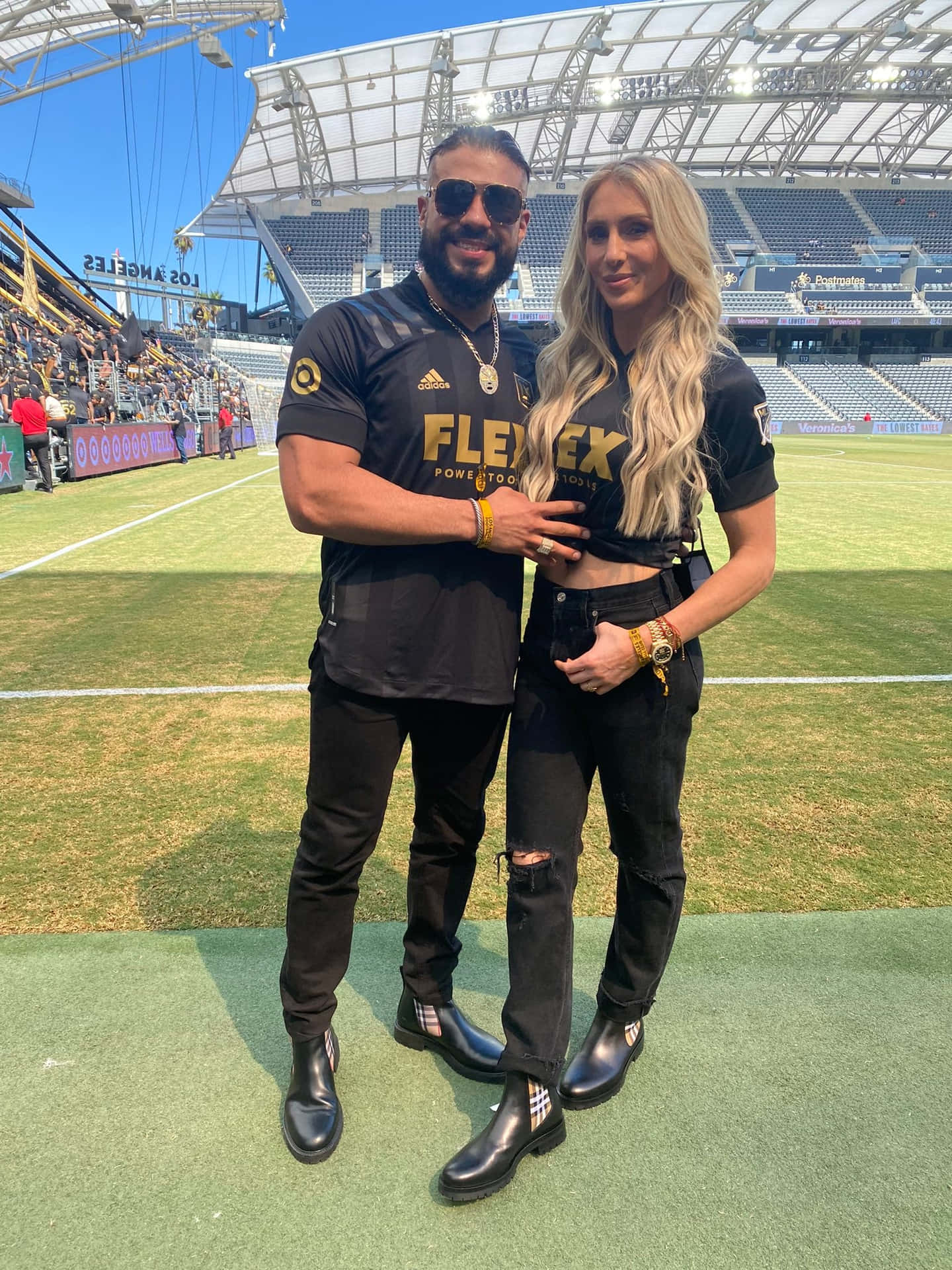 WWE Superstars - Andrade El Idolo and Charlotte Flair Wallpaper