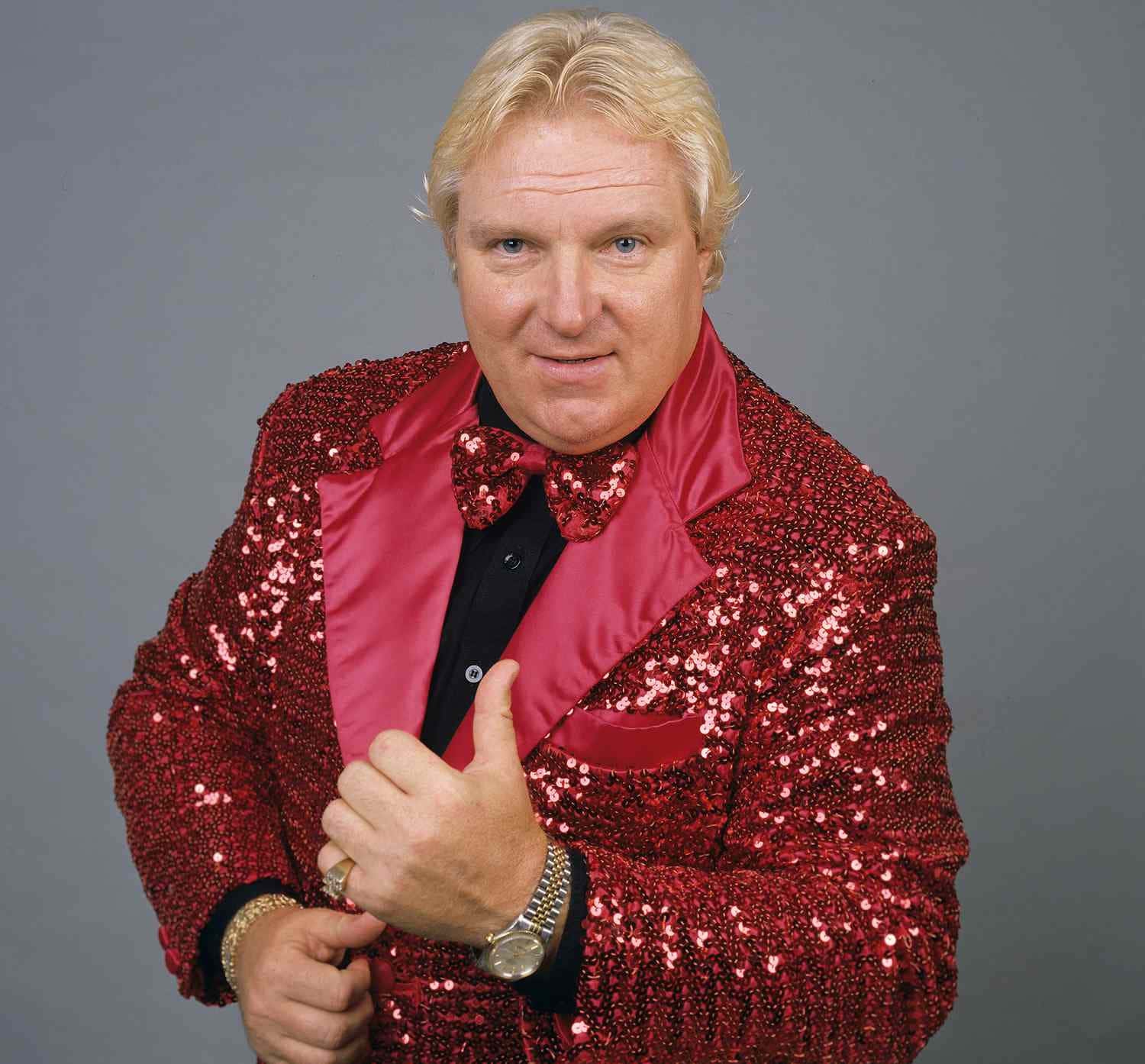 Legendary Wrestler Bobby 'The Brain' Heenan in Striking Red Suit Wallpaper