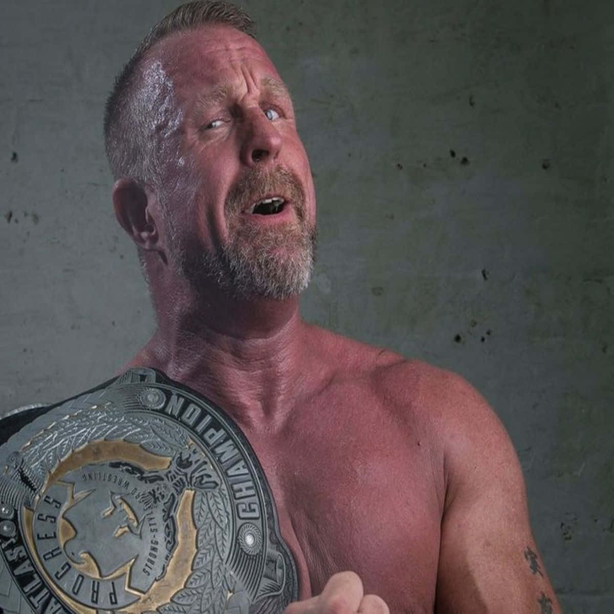 Wrestler Doug Williams Holding Championship Belt Picture
