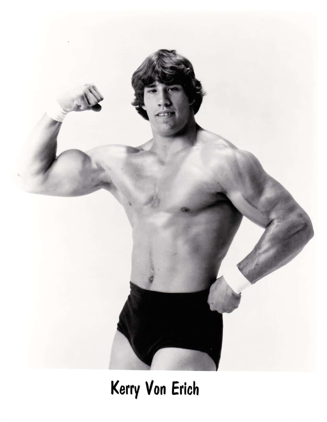 Legendary Wrestler Kerry Von Erich Showcasing His Strength Wallpaper