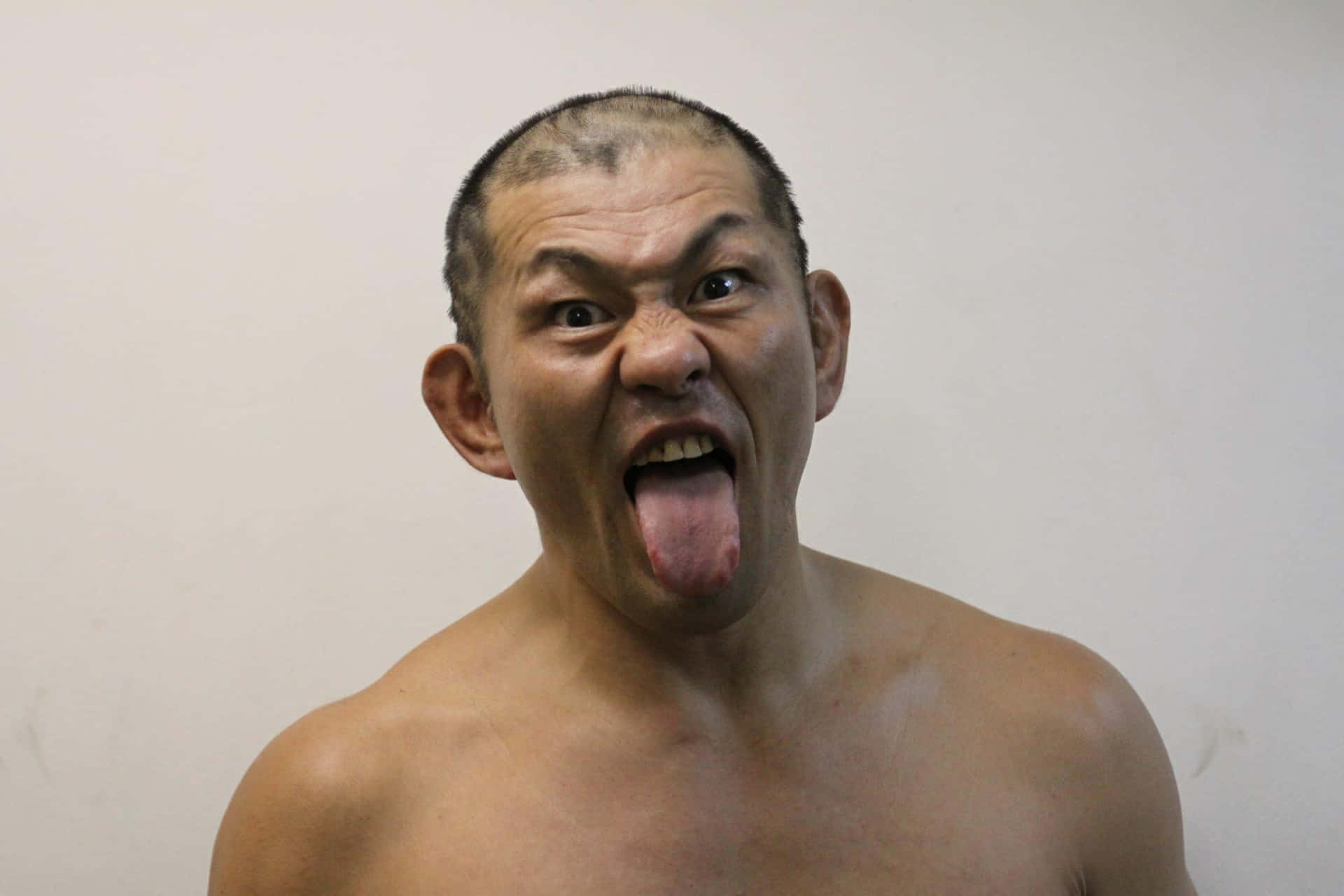 Intense Action Shot of Wrestler Minoru Suzuki Wallpaper