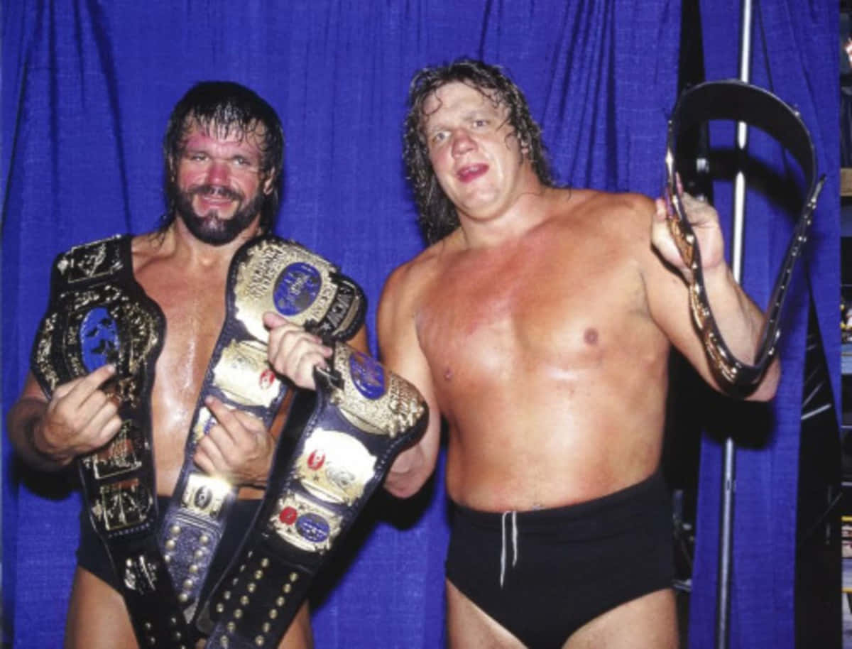Champions of the Ring - Terry Gordy and Steve Williams Holding Championship Belts in 1992. Wallpaper