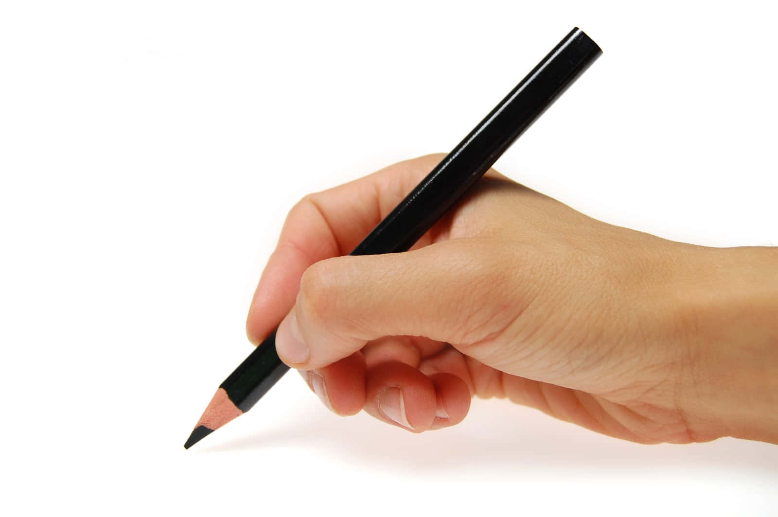 A Hand Holding A Black Pencil