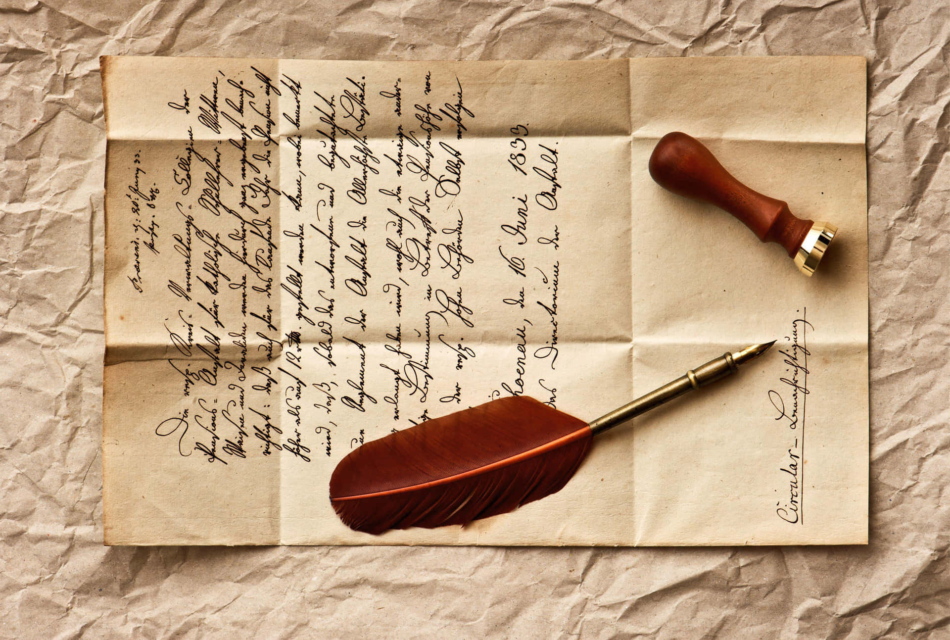 A Feather And A Quill On A Piece Of Paper
