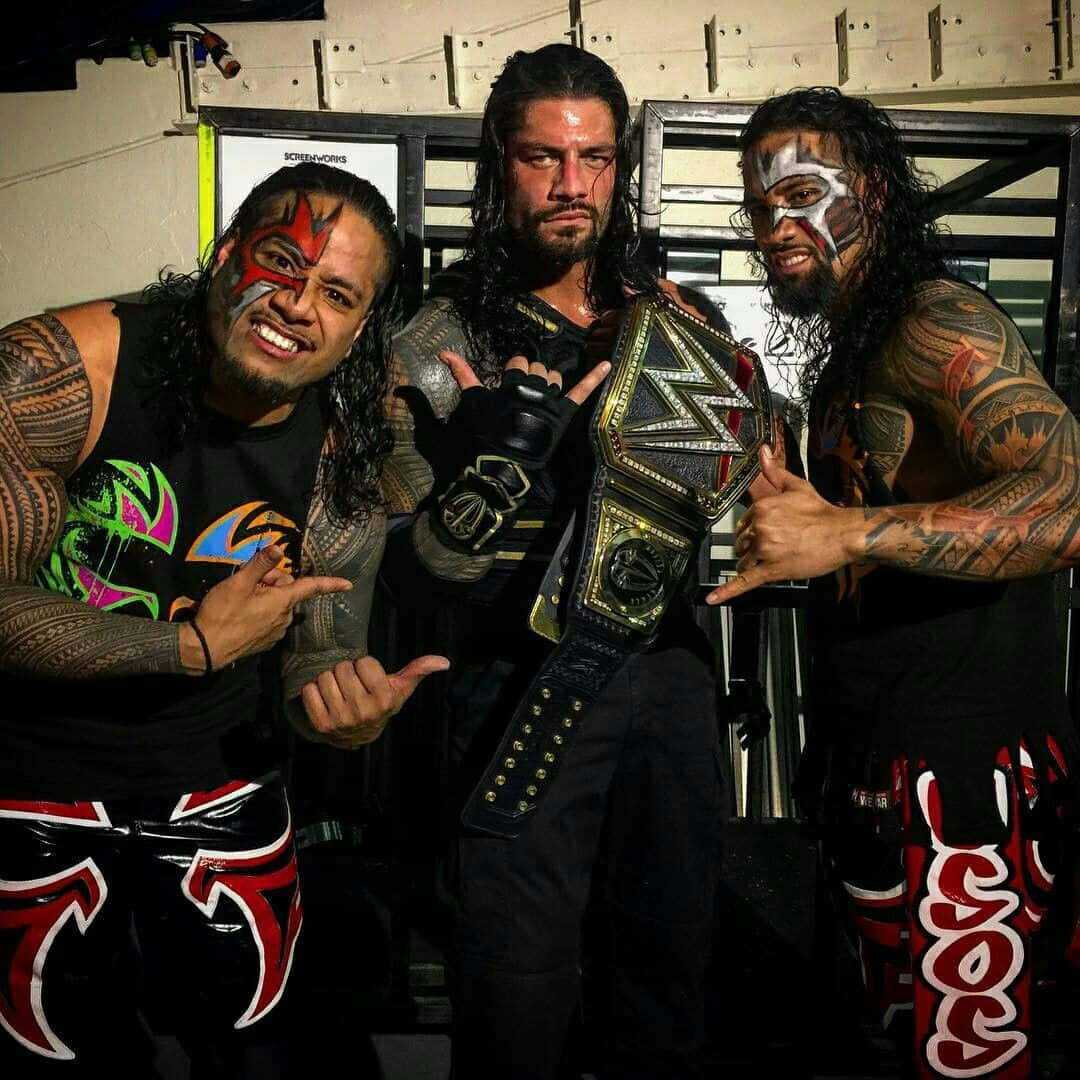 Wwe Roman Reigns With Jimmy And Jey Uso Wallpaper