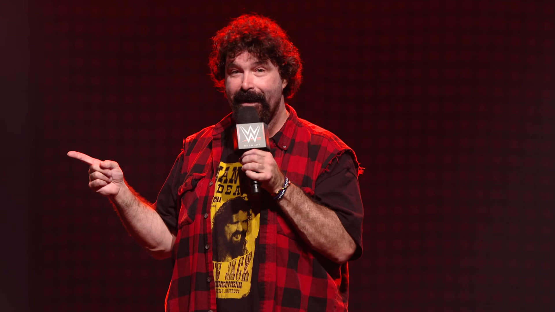 Mick Foley: A WWE Legend Discussing his Journey Wallpaper
