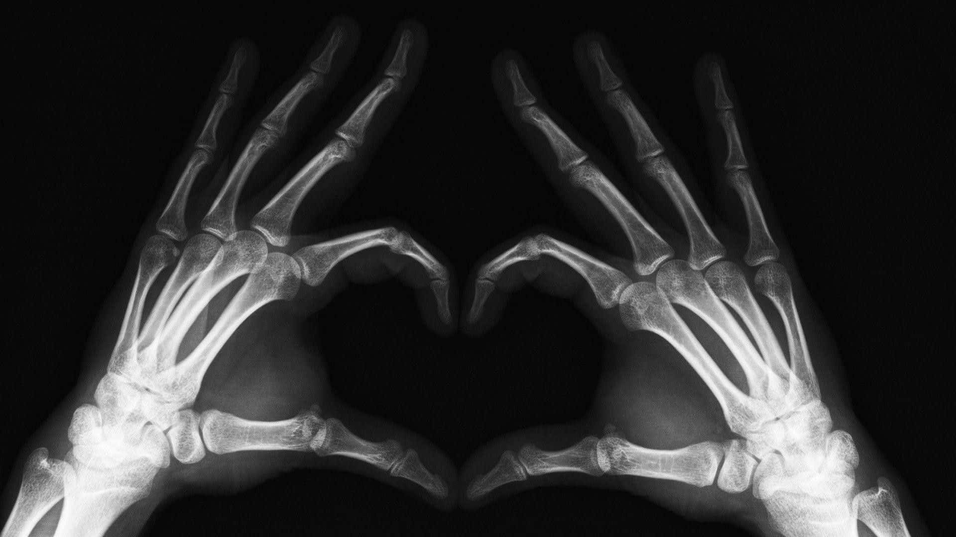 Hands Making A Heart Shape In Black And White Photo Wallpaper