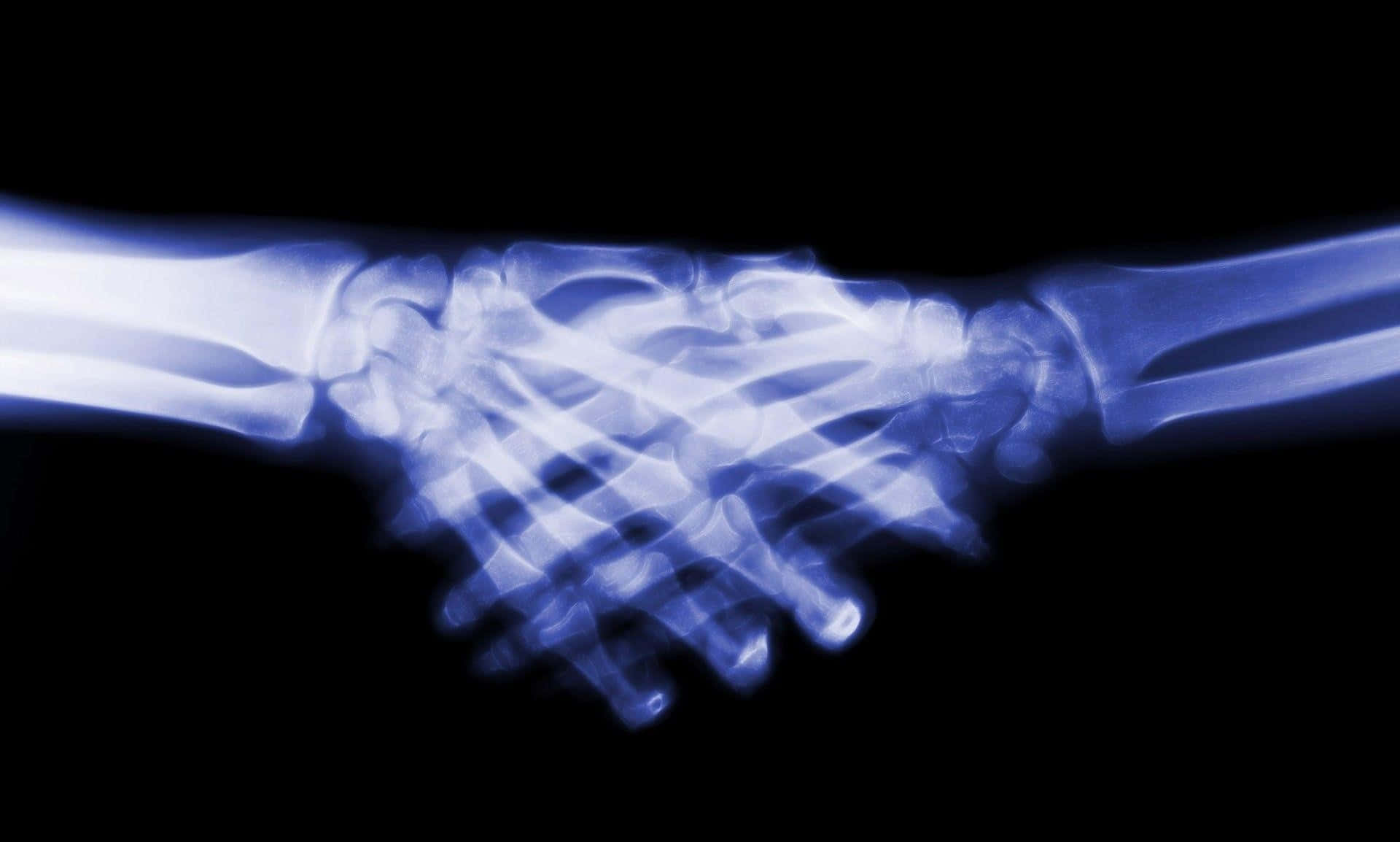 A Pair Of Hands Holding Hands With A Blue Background