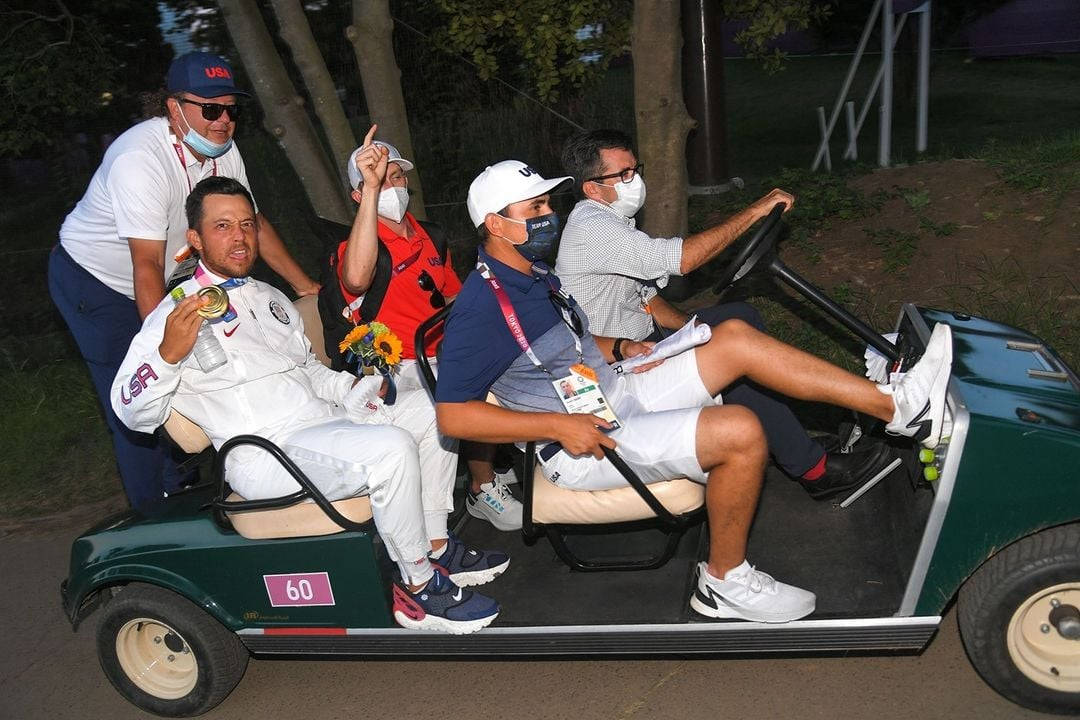 Xander Schauffele Riding Golf Cart Wallpaper
