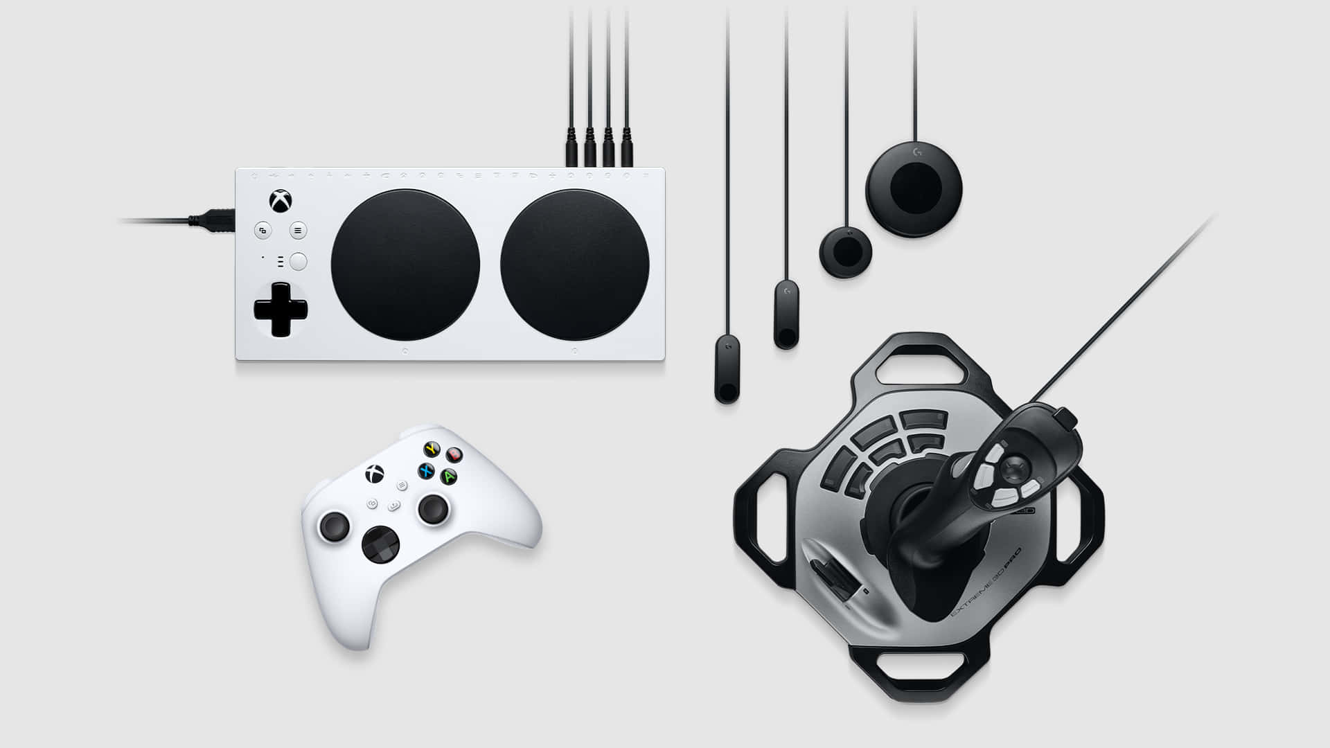 A White And Black Gaming Controller And Other Accessories