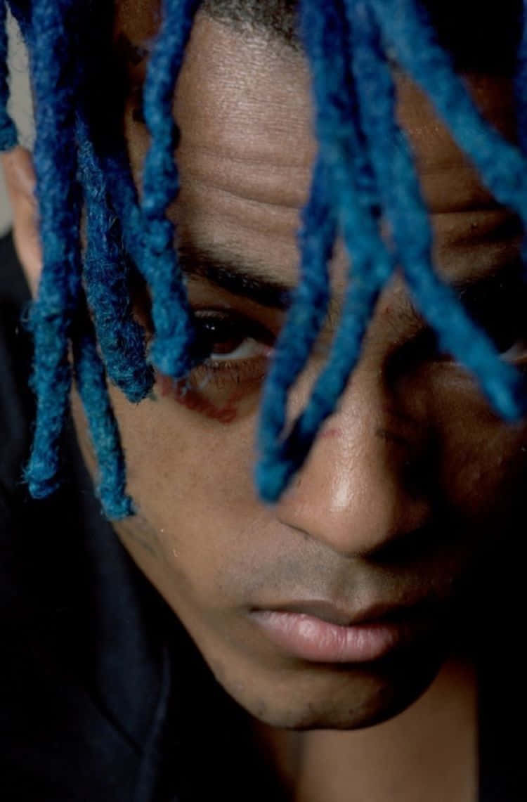 Singer XXXTentacion Looking Fierce with His Electric Blue Hair Wallpaper