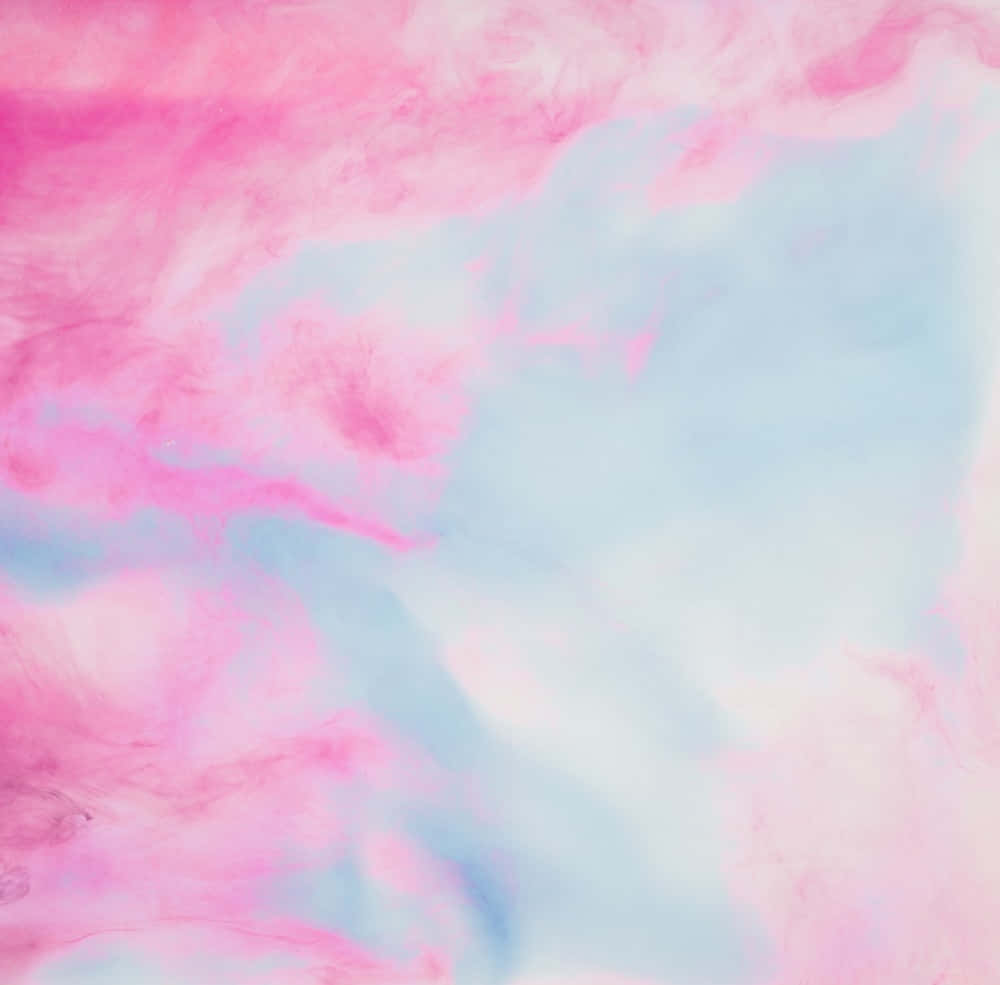 A Pink And Blue Liquid Paint On A White Background