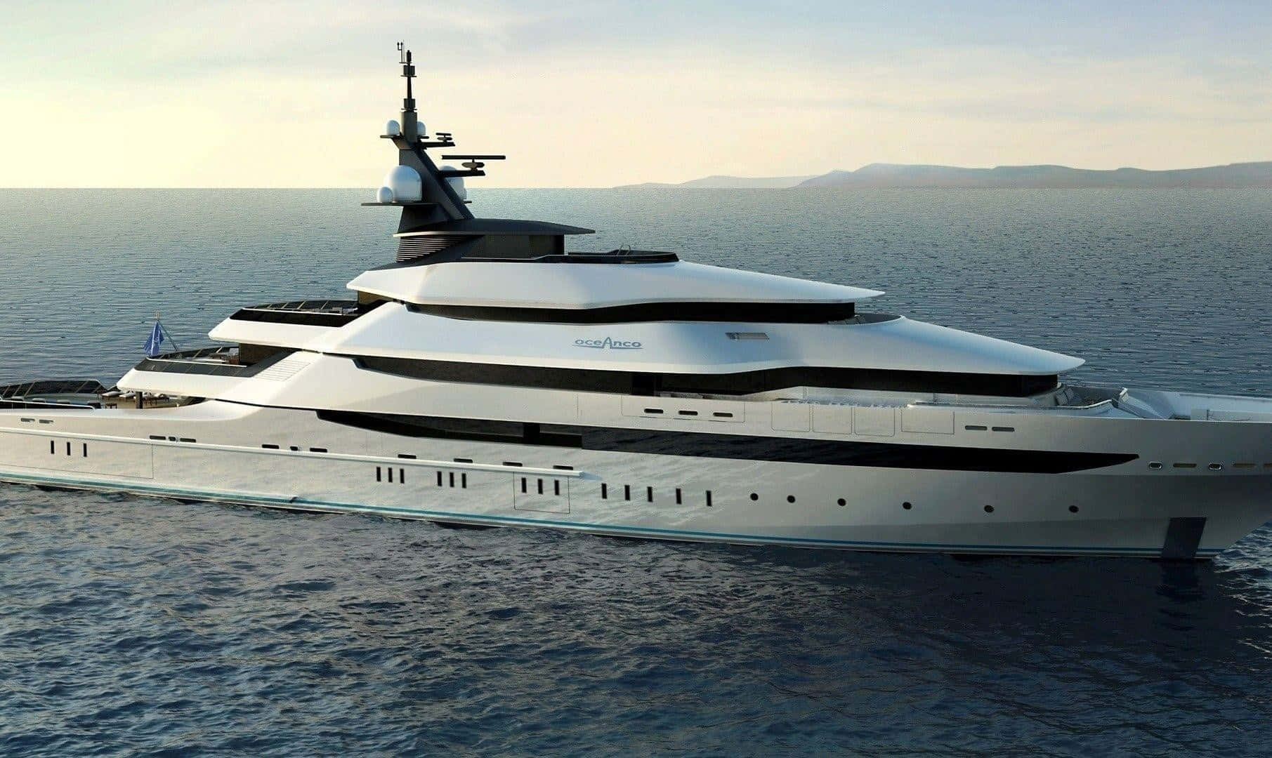 A stunning luxury yacht anchoring off of the stunning Mediterranean coastline