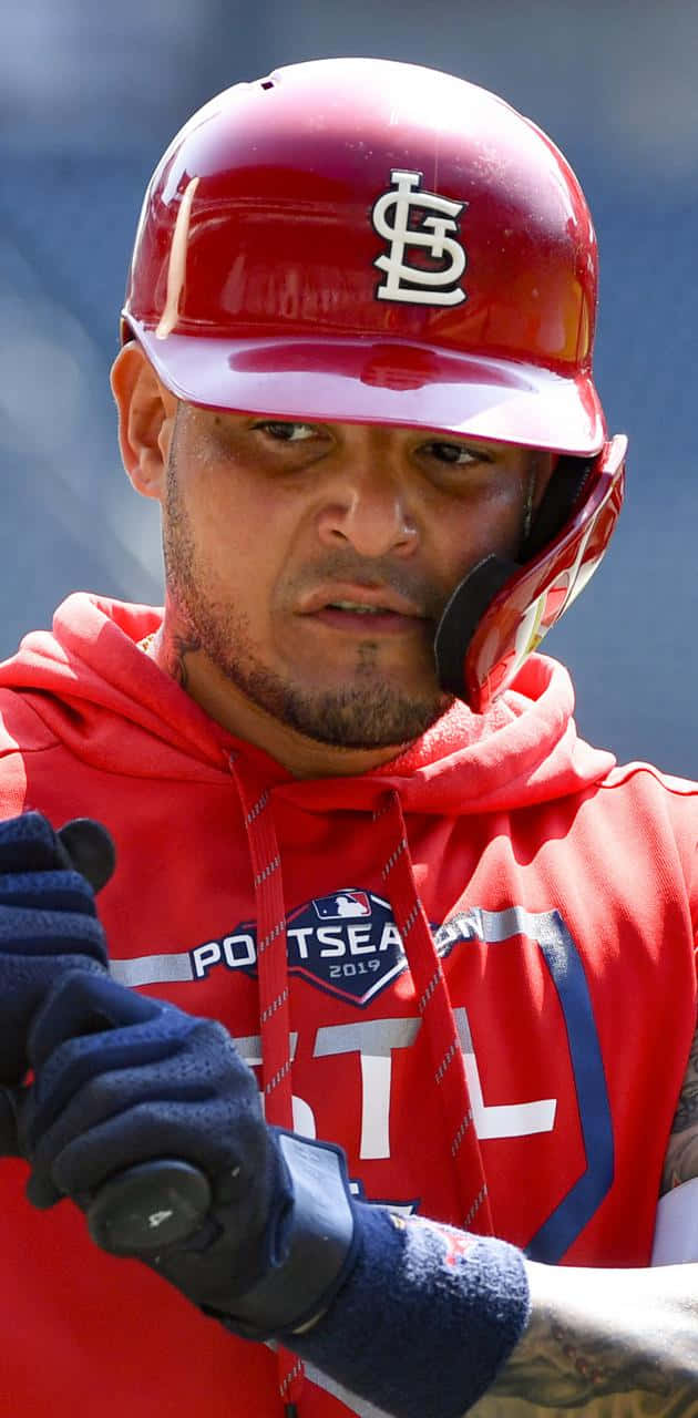 A Baseball Player With A Bat And A Helmet Wallpaper