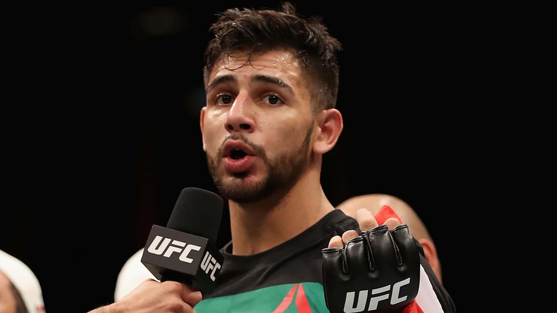 Yair Rodriguez Showcasing His Kickboxing Skills In The Octagon Wallpaper