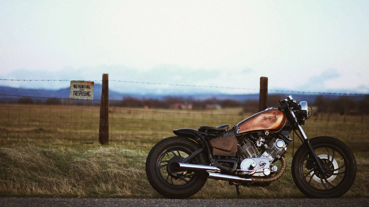 Sublime Yamaha Virago Bobber Motorcycle Gleaming in the Sun Wallpaper