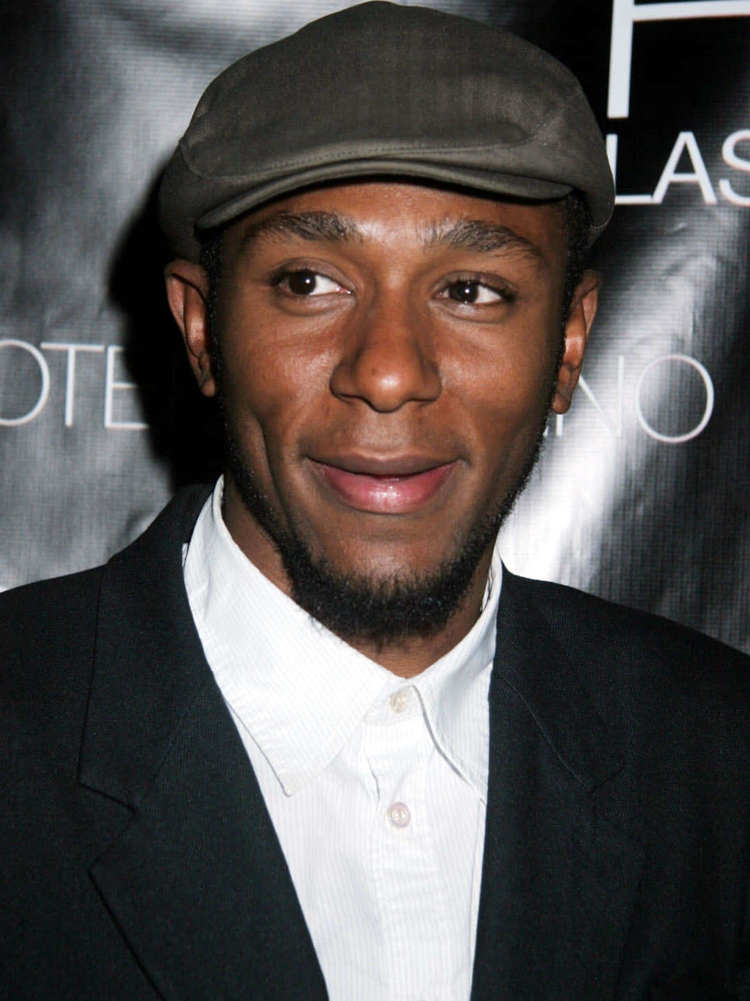 Yasiin Bey Tijdens Live Optreden Achtergrond