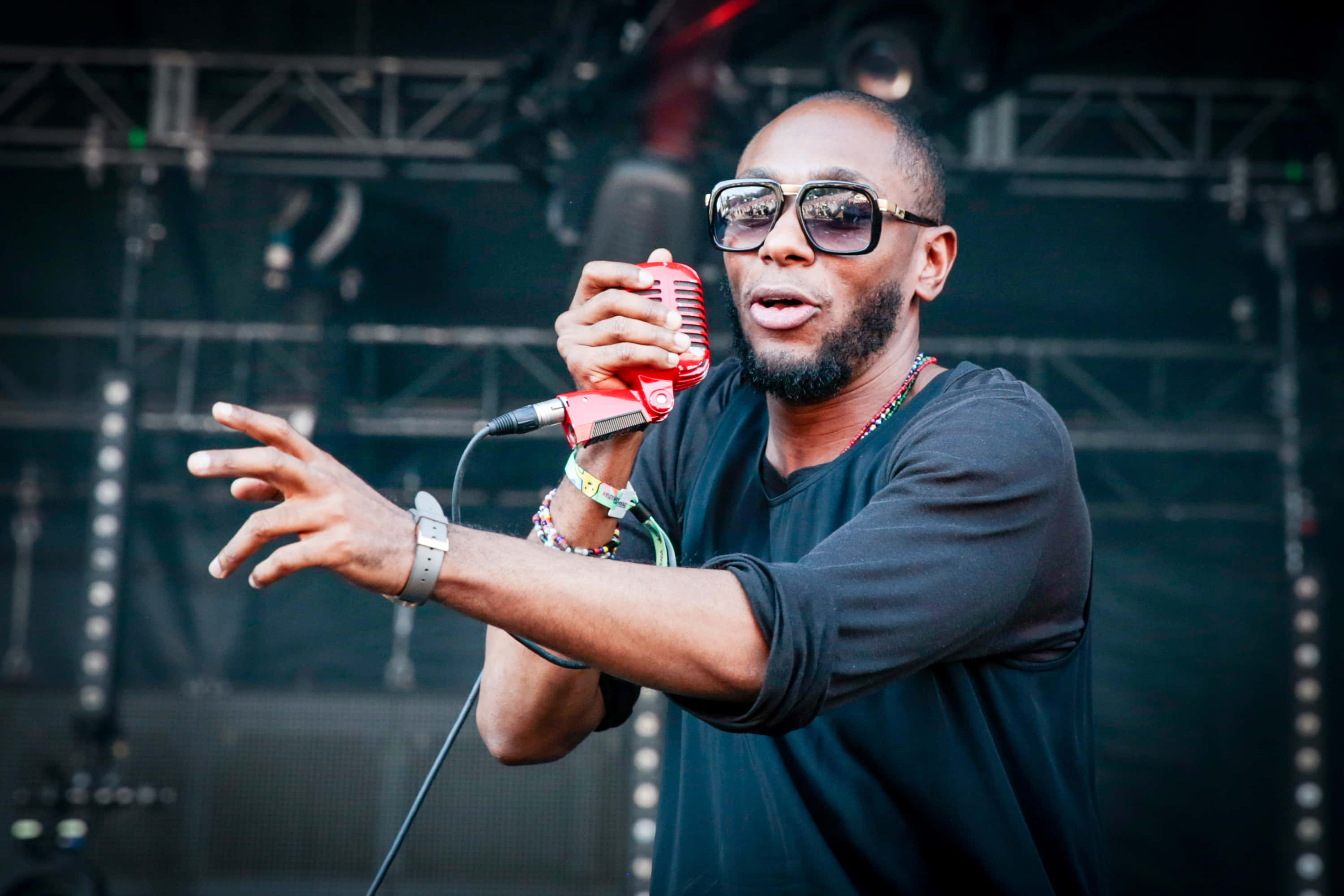 Download Yasiin Bey In A Promotional Photo Shoot Wallpaper