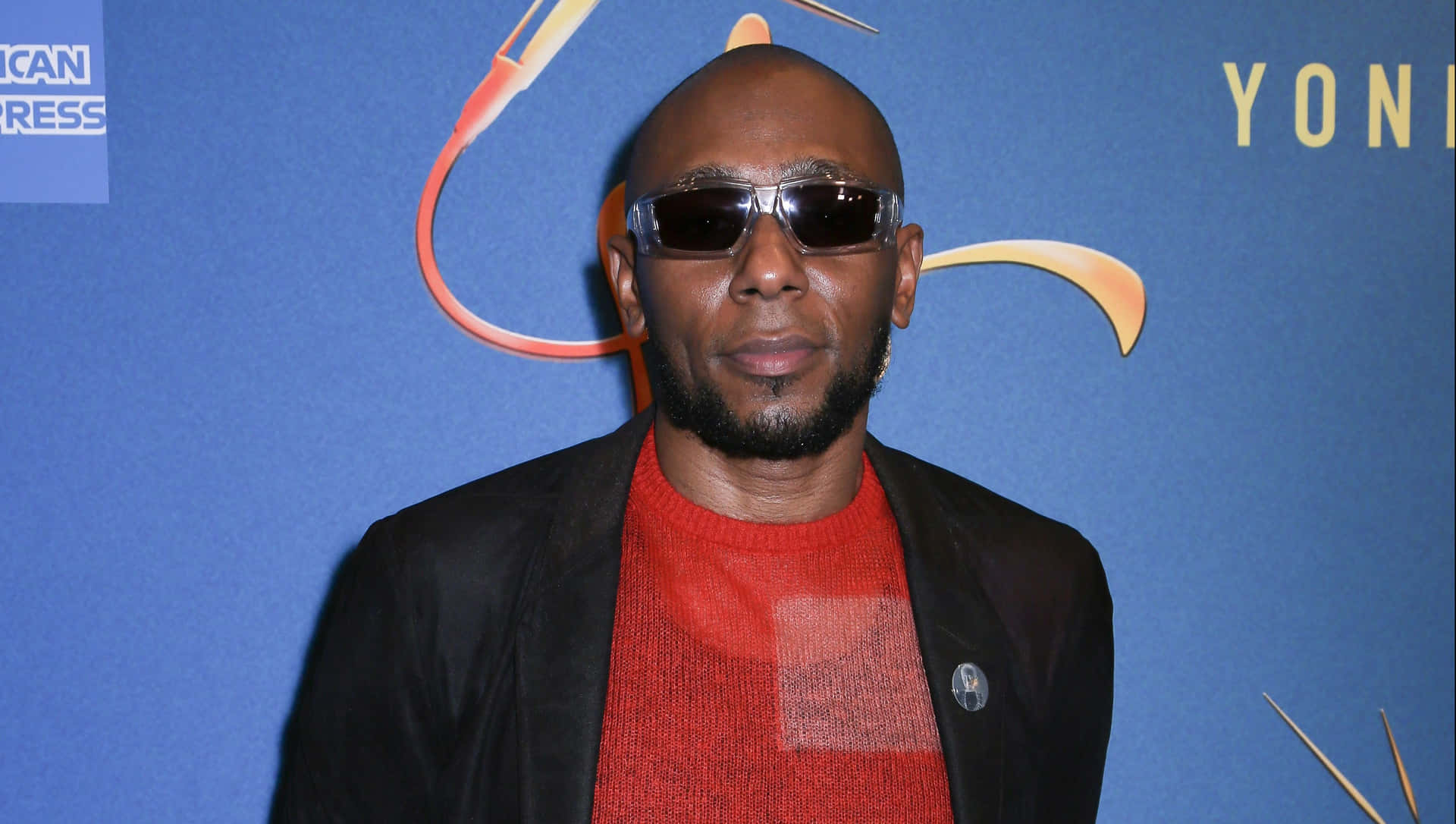 Download Yasiin Bey In A Promotional Photo Shoot Wallpaper
