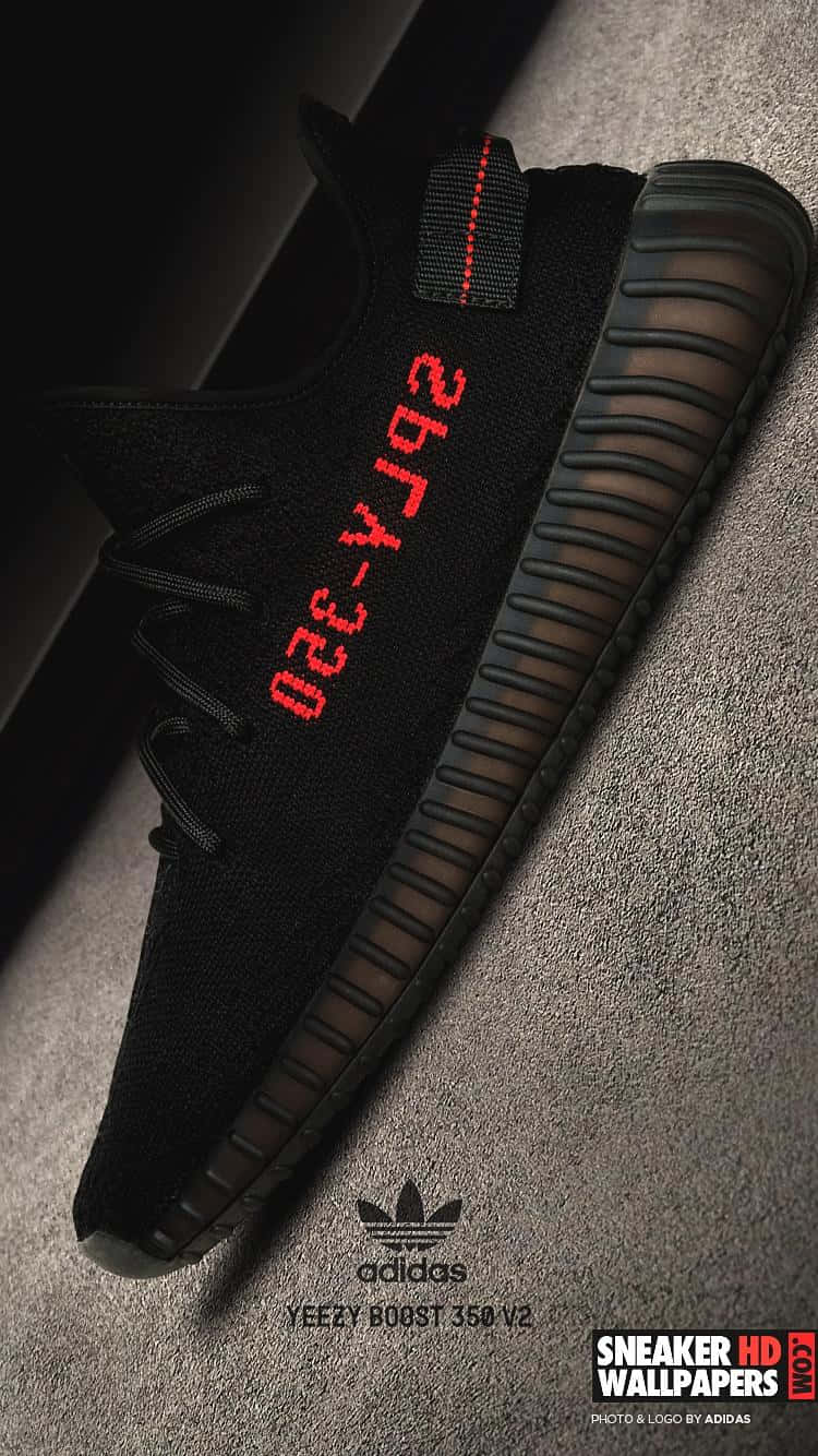 A Black And Red Adi Yeezy Sneaker Wallpaper