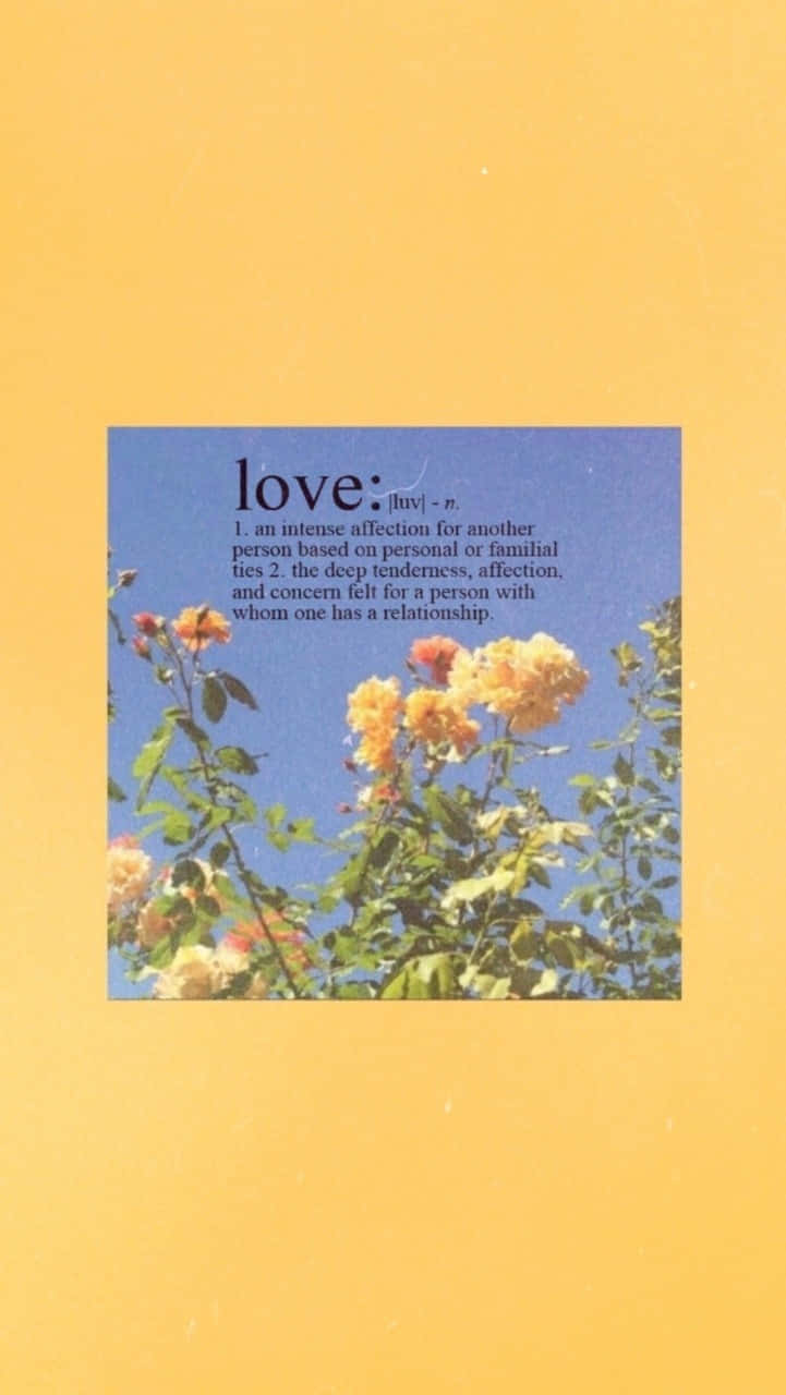 Love - A Yellow Card With A Quote On It Wallpaper