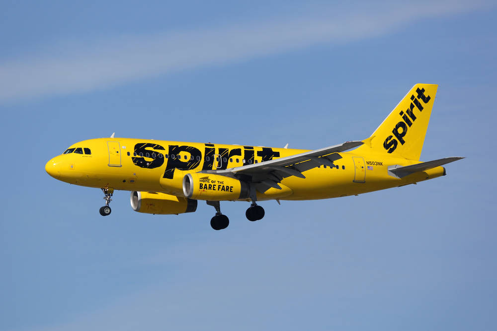 Gul Flyvemaskine Med Spirit Airlines Logo Det Flyvende Vandreturende Wallpaper