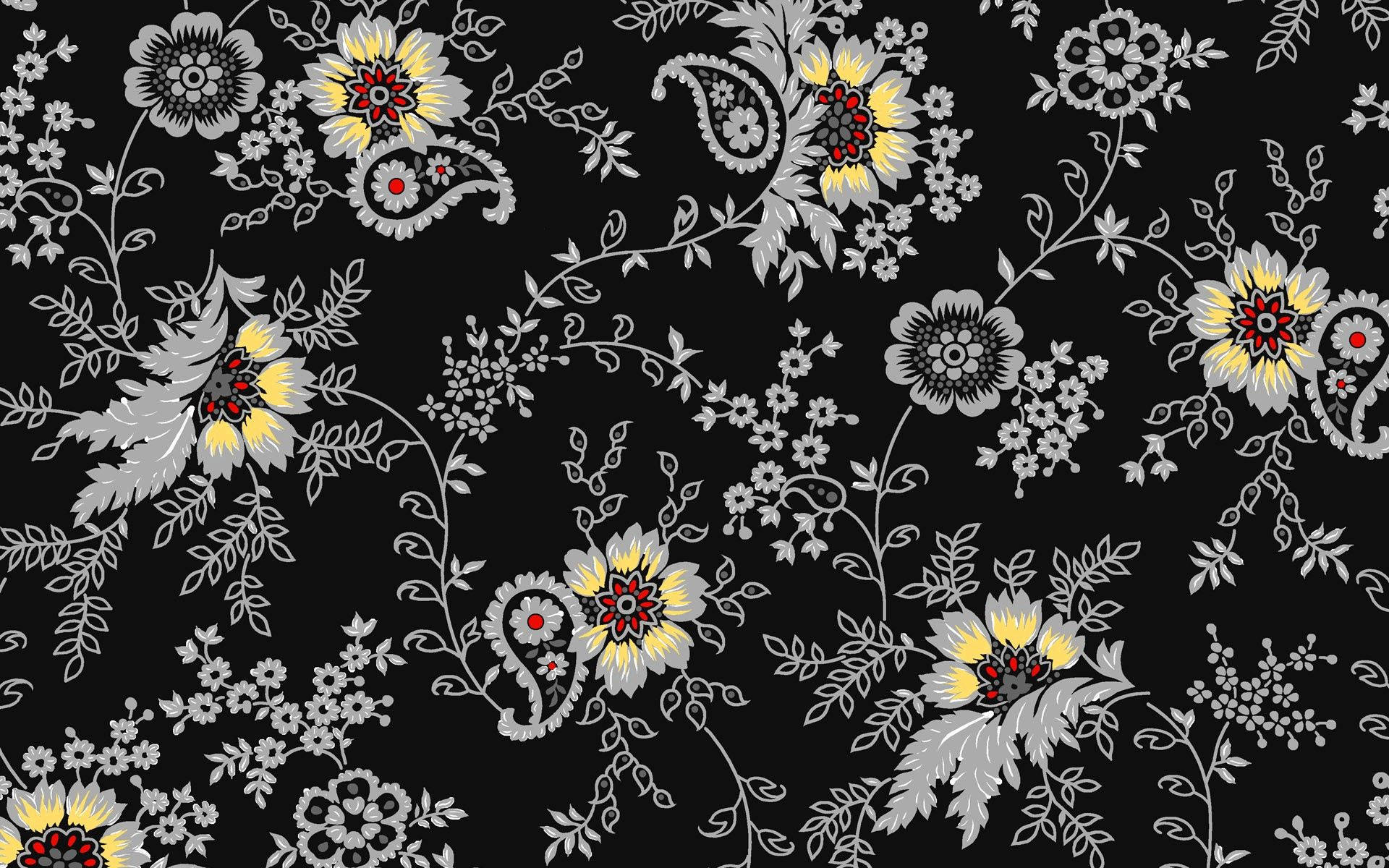 Grey flower pattern with red and yellow on black background.