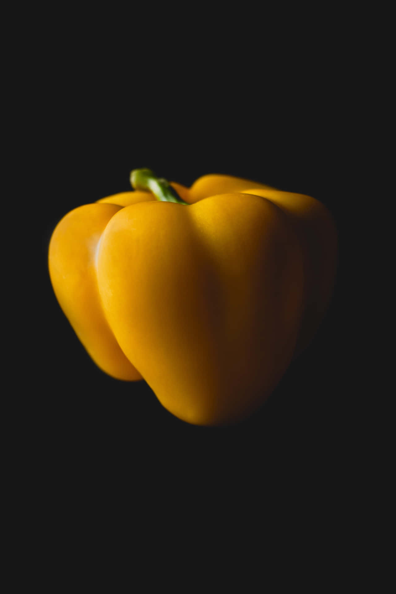Fresh Yellow Bell Pepper on a Vibrant Background Wallpaper