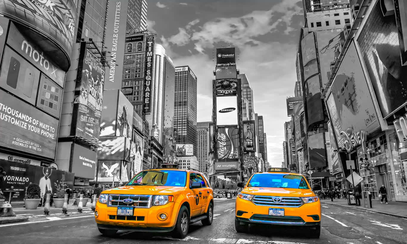 Vibrant Yellow Cab in the City Streets Wallpaper