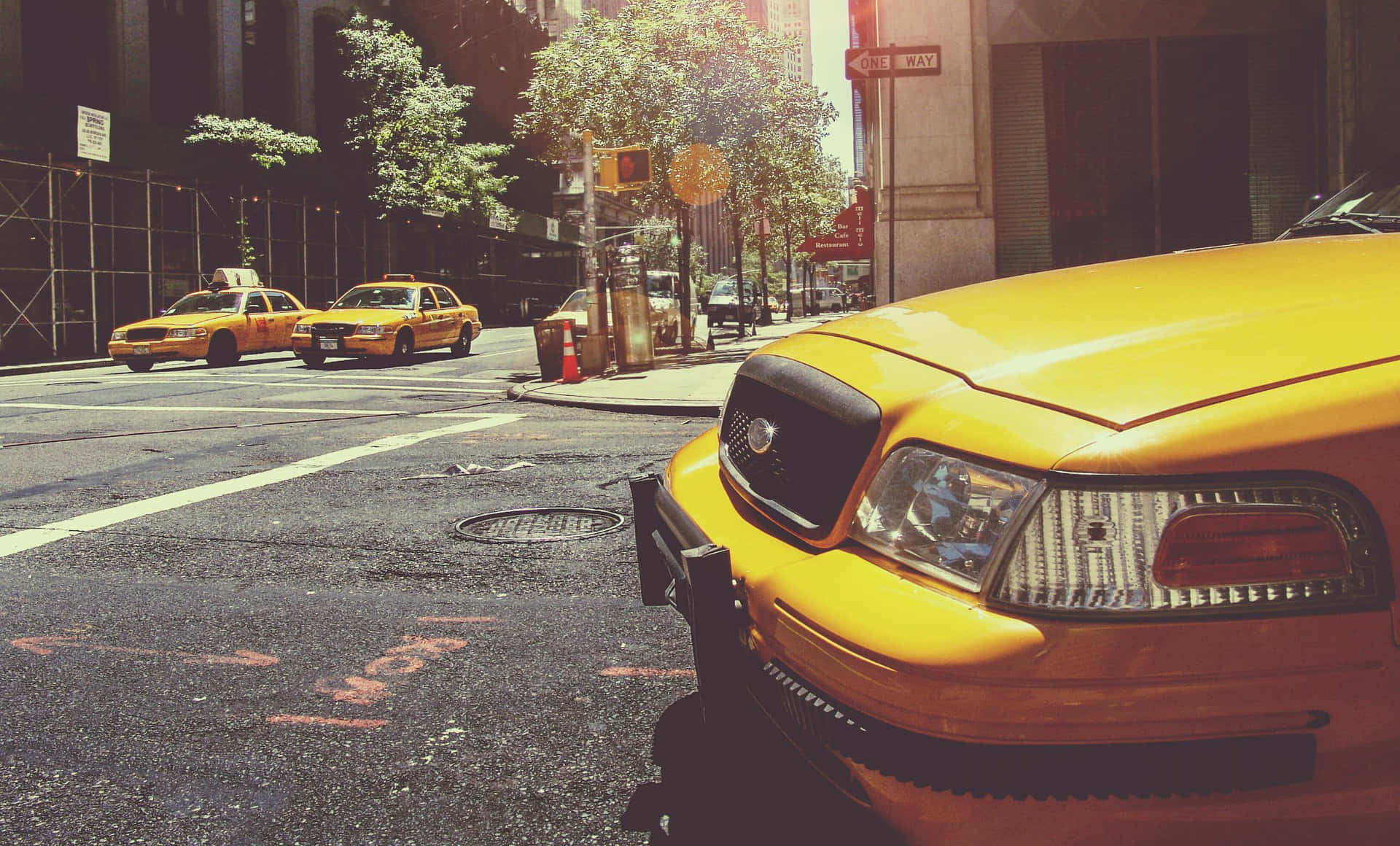 Bright Yellow Cab in the City Wallpaper