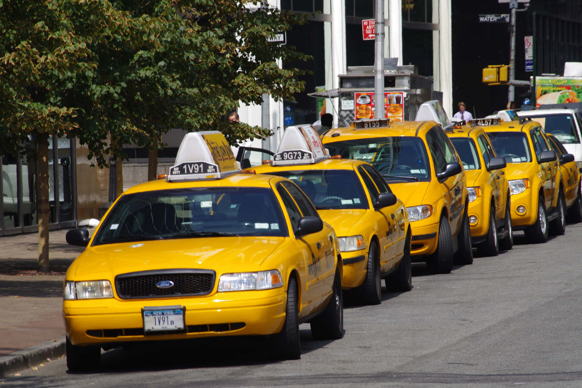 Iconic Yellow Cab in a Vibrant City Wallpaper