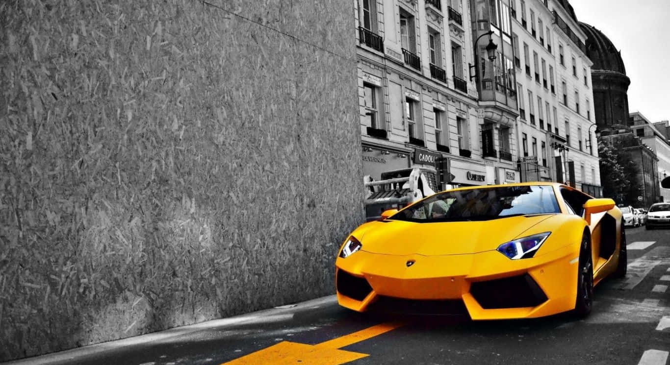 Vibrant Yellow Sports Car in Motion Wallpaper