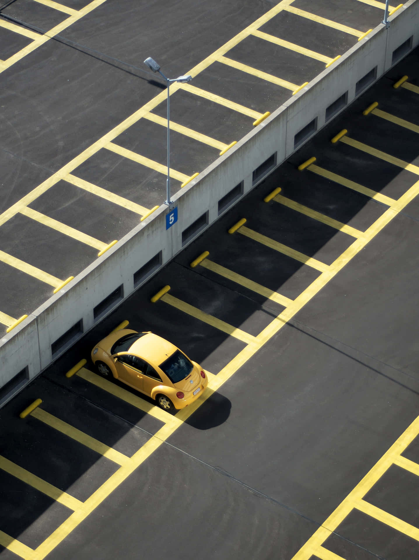 Yellow Car In Parking Lot Wallpaper