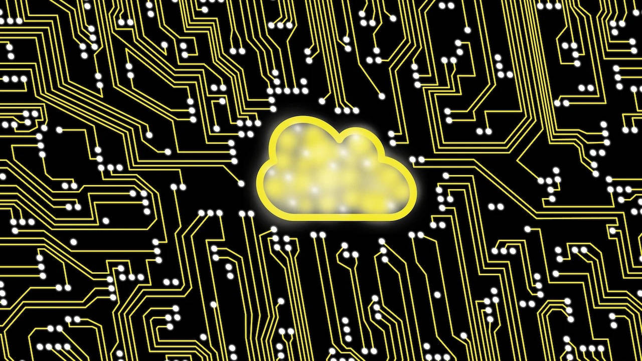 Yellow Cloud Storage Icon On A Circuit Board Wallpaper