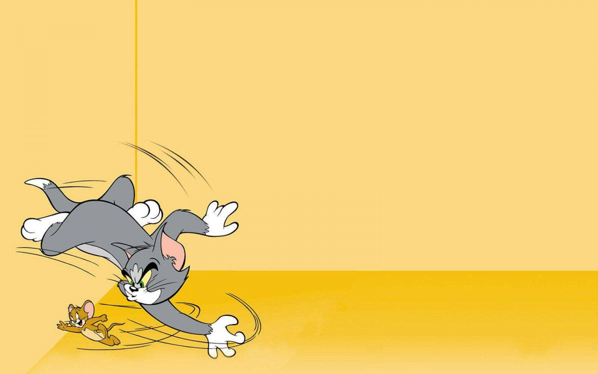 Yellow-colored Tom And Jerry Background