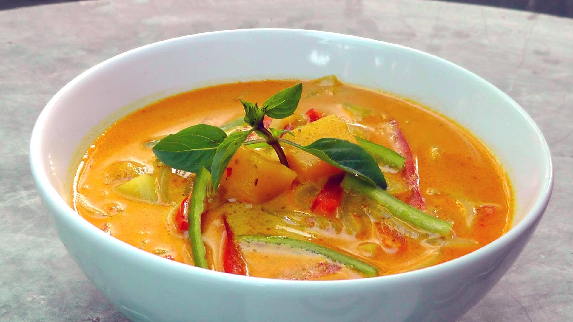 Yellow Curry Topped With Basil Herbs And Chili Wallpaper