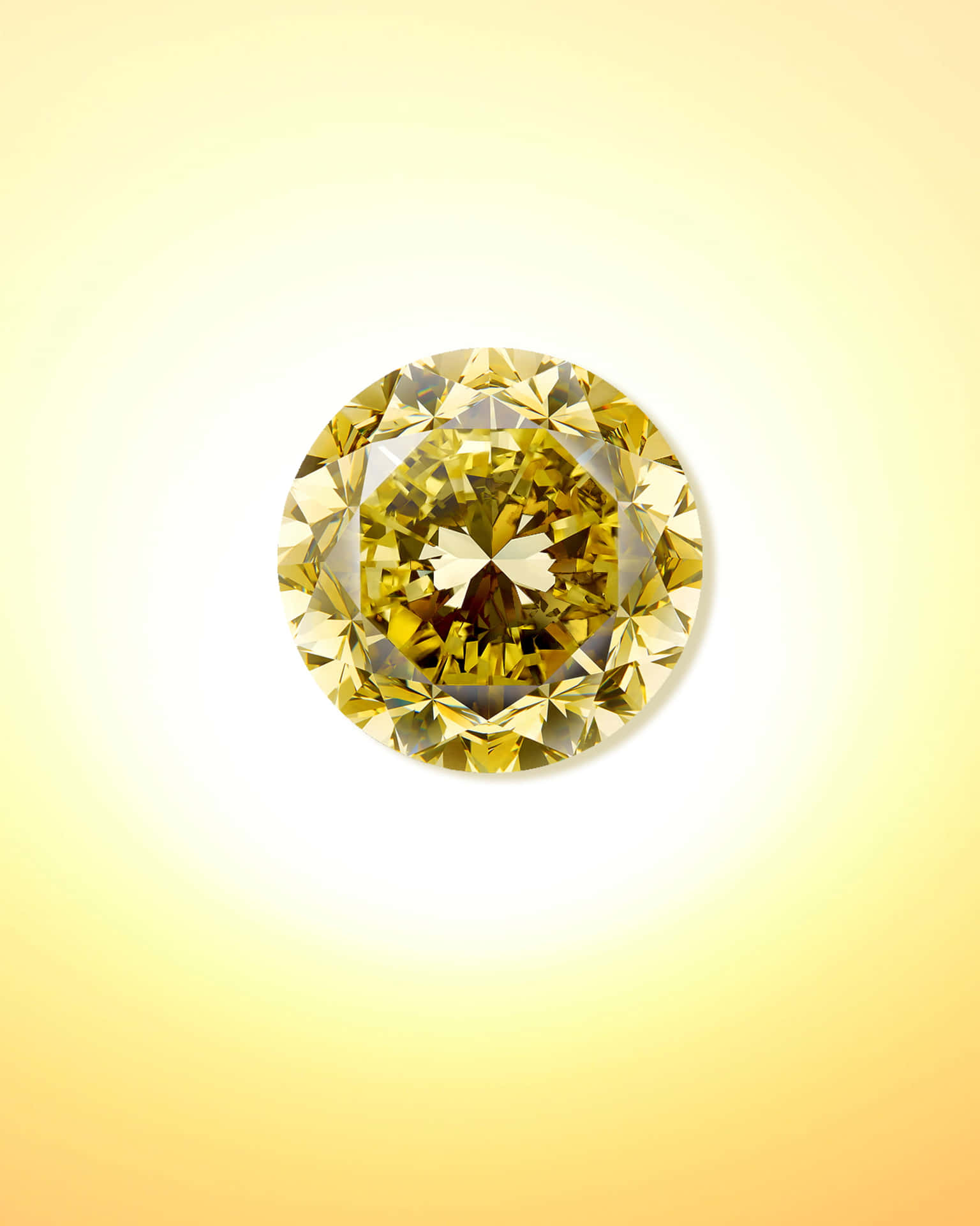 A stunning and luxurious yellow diamond shining brightly against a dark background Wallpaper