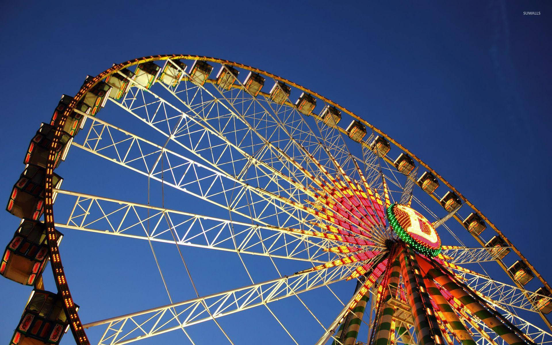 Yellow Ferris Wheel Under Blue Sky Wallpaper