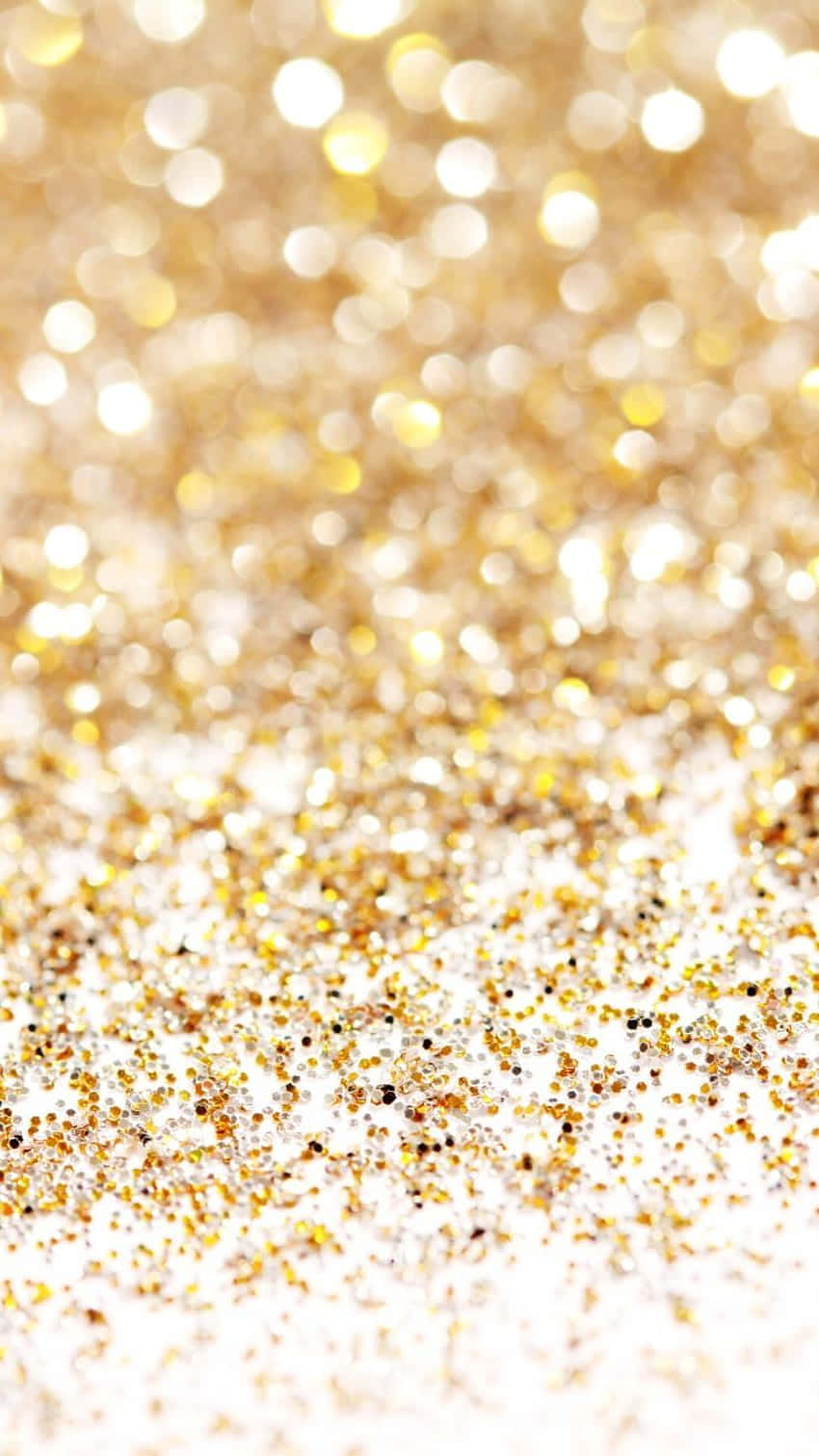 Umclose-up De Glitter Dourado Em Um Fundo Branco. Papel de Parede