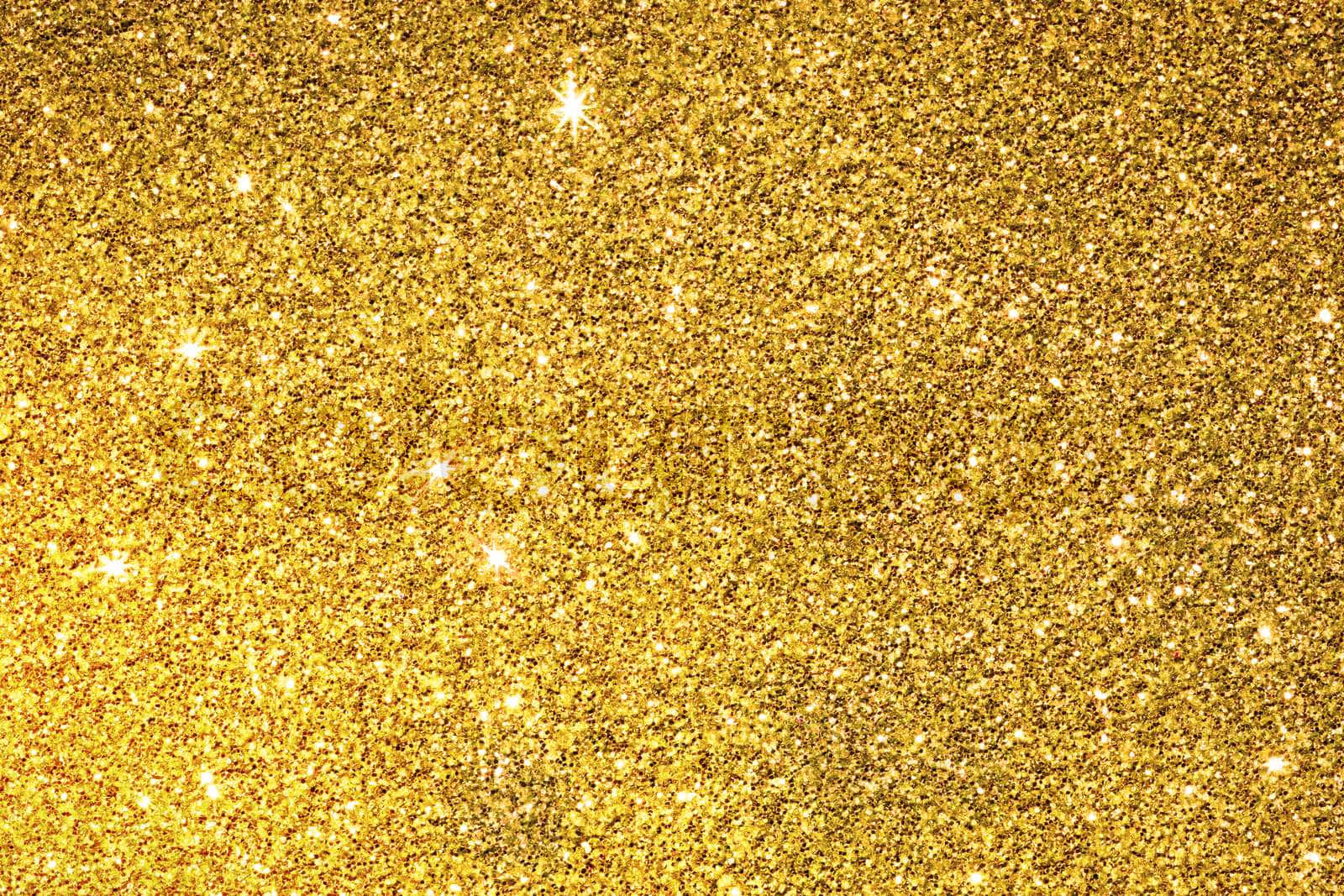 A Gold Glitter Background With Stars