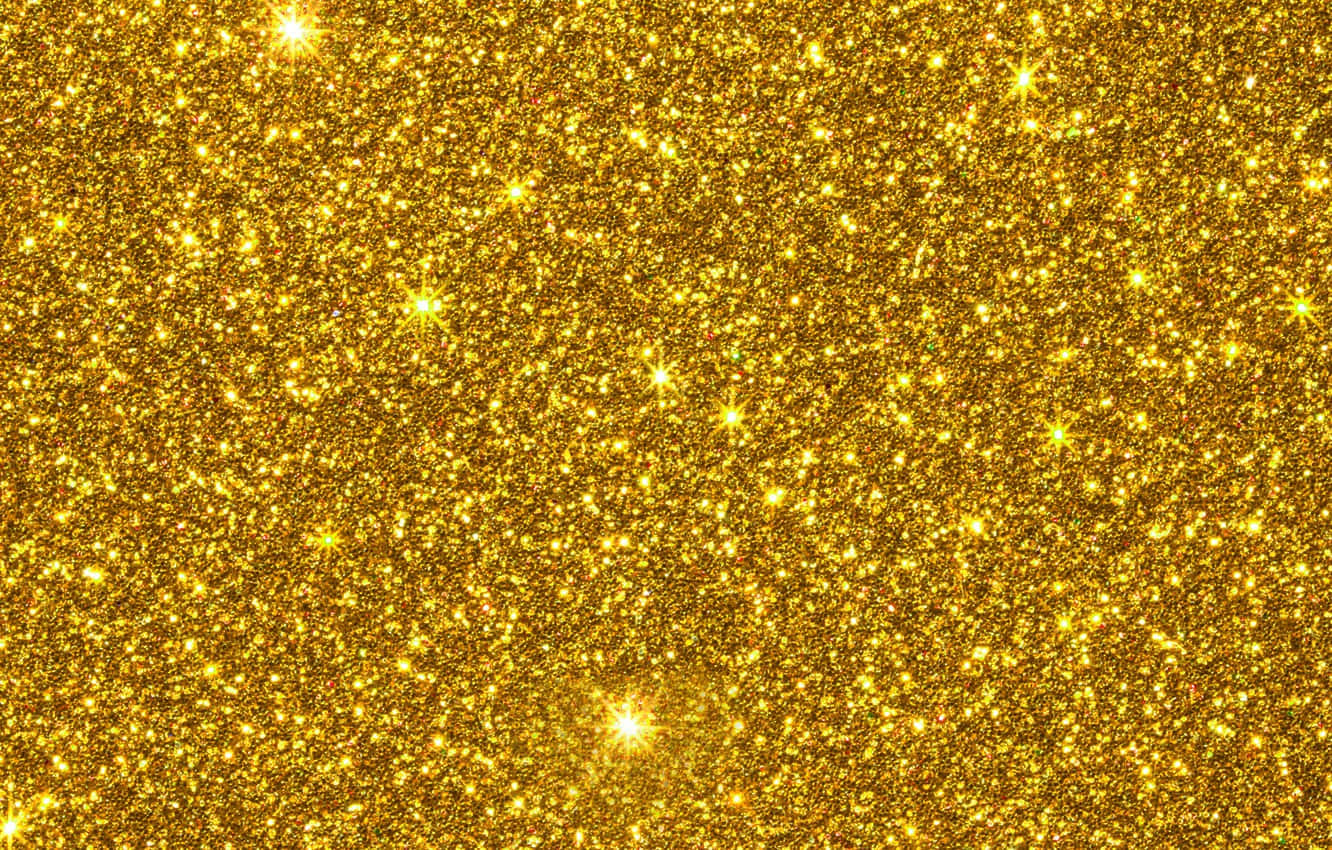 A Gold Glitter Background With Stars Wallpaper