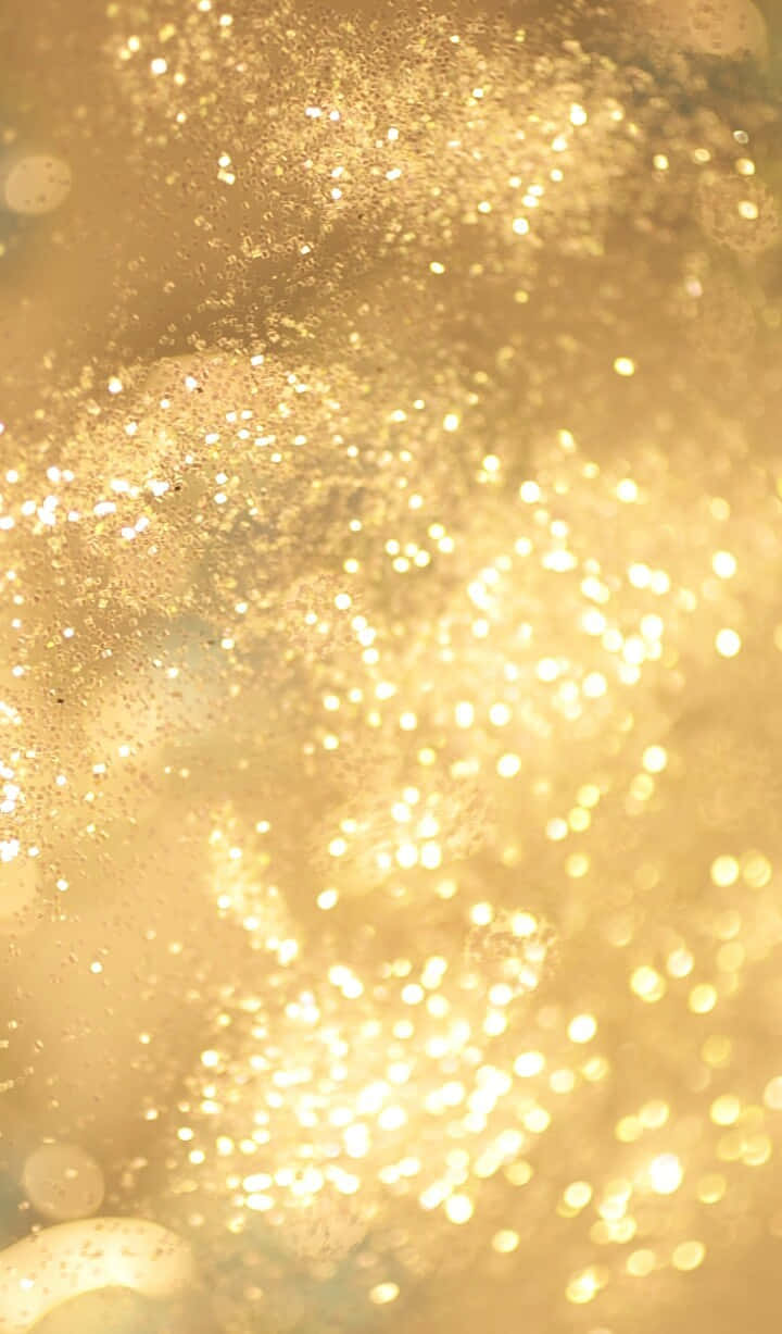A Close Up Of A Gold Glitter Background Wallpaper