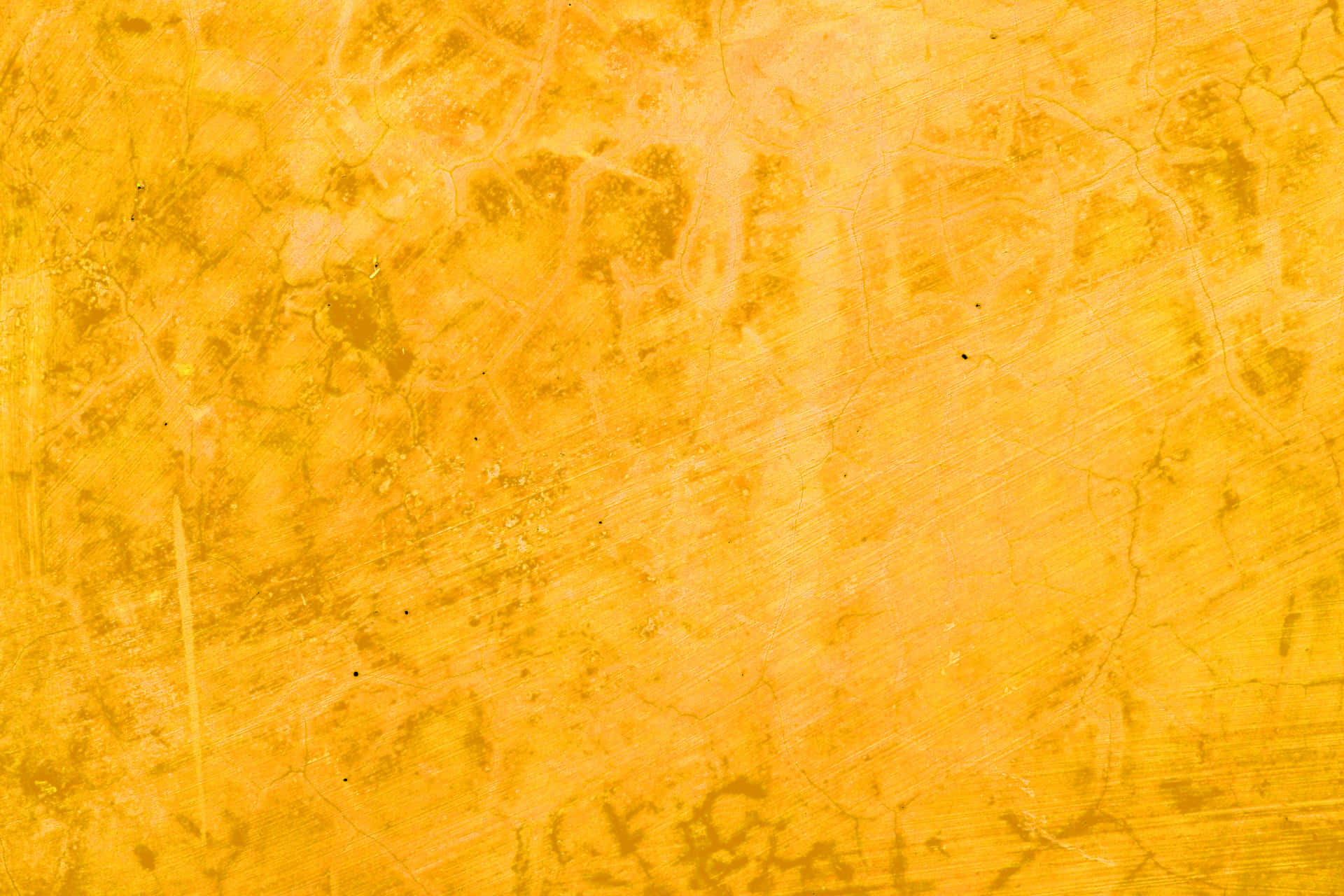 A Yellow Background With A Textured Surface Wallpaper