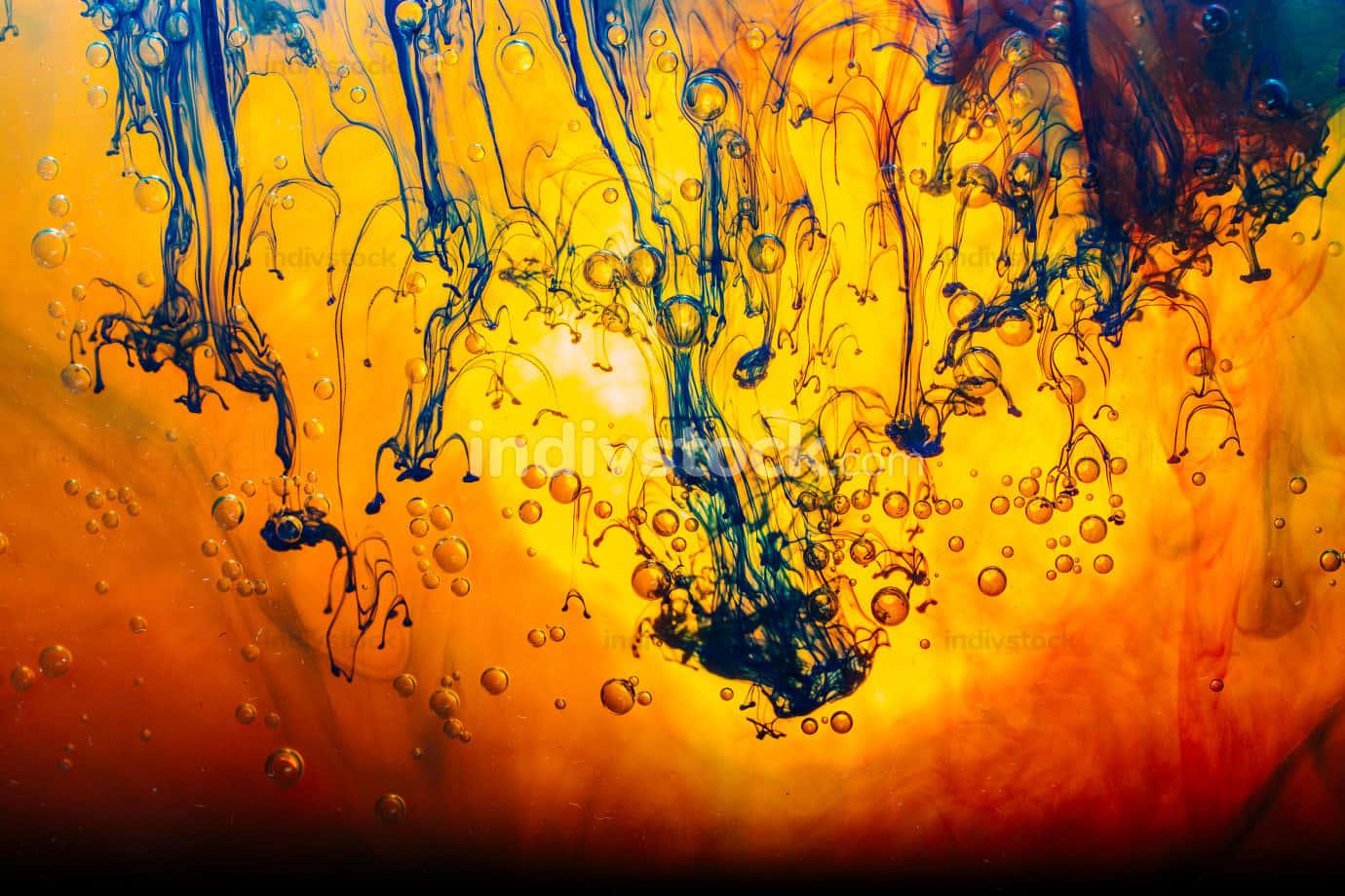 A Colorful Liquid With Orange And Blue Splashes Wallpaper