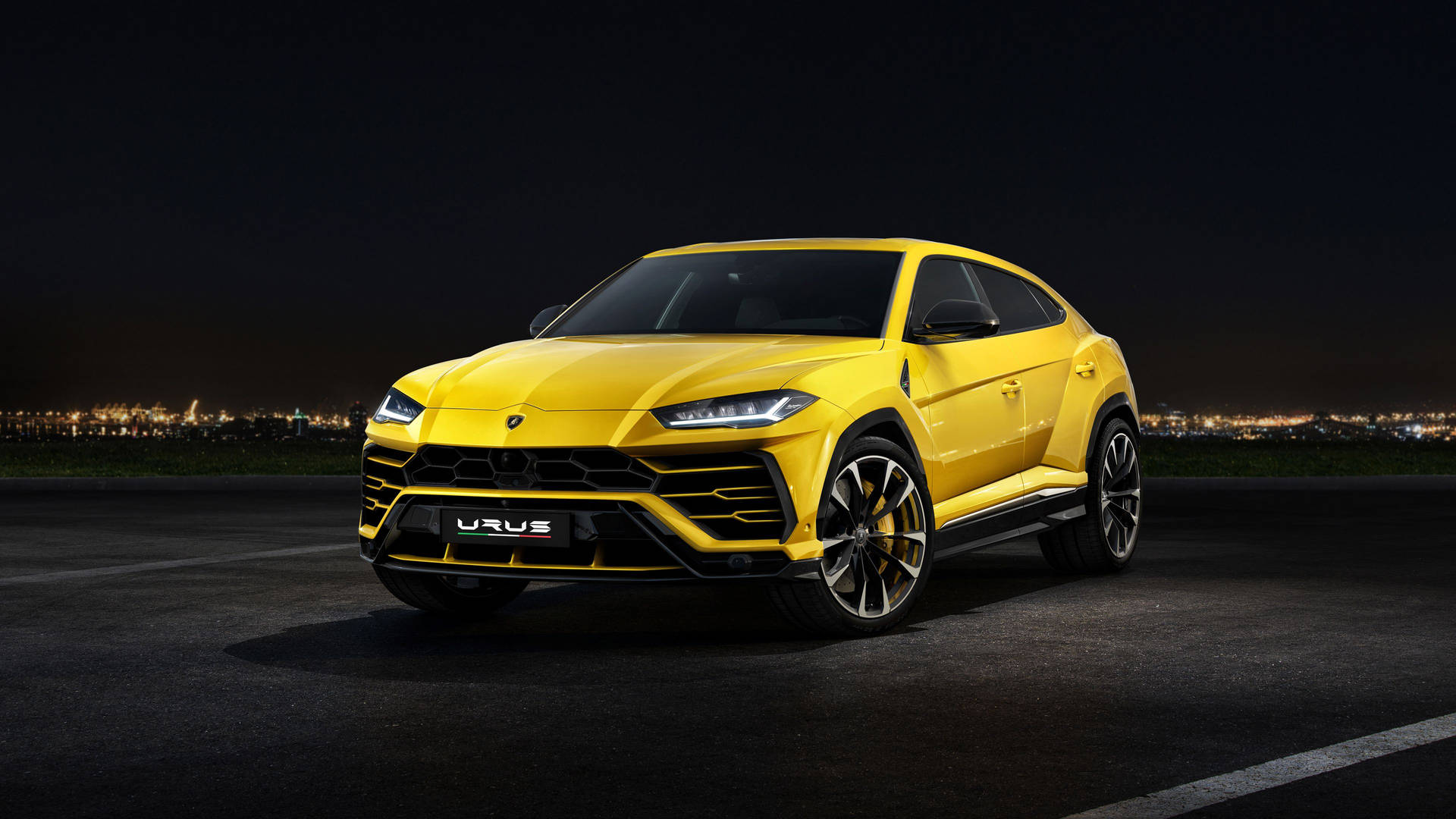 Yellow Lamborghini Urus At Night Wallpaper