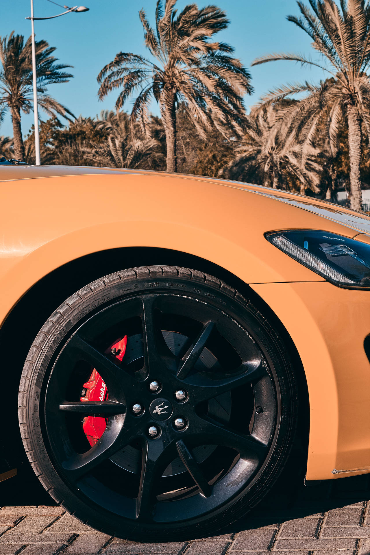 Yellow Maserati Tire Shot