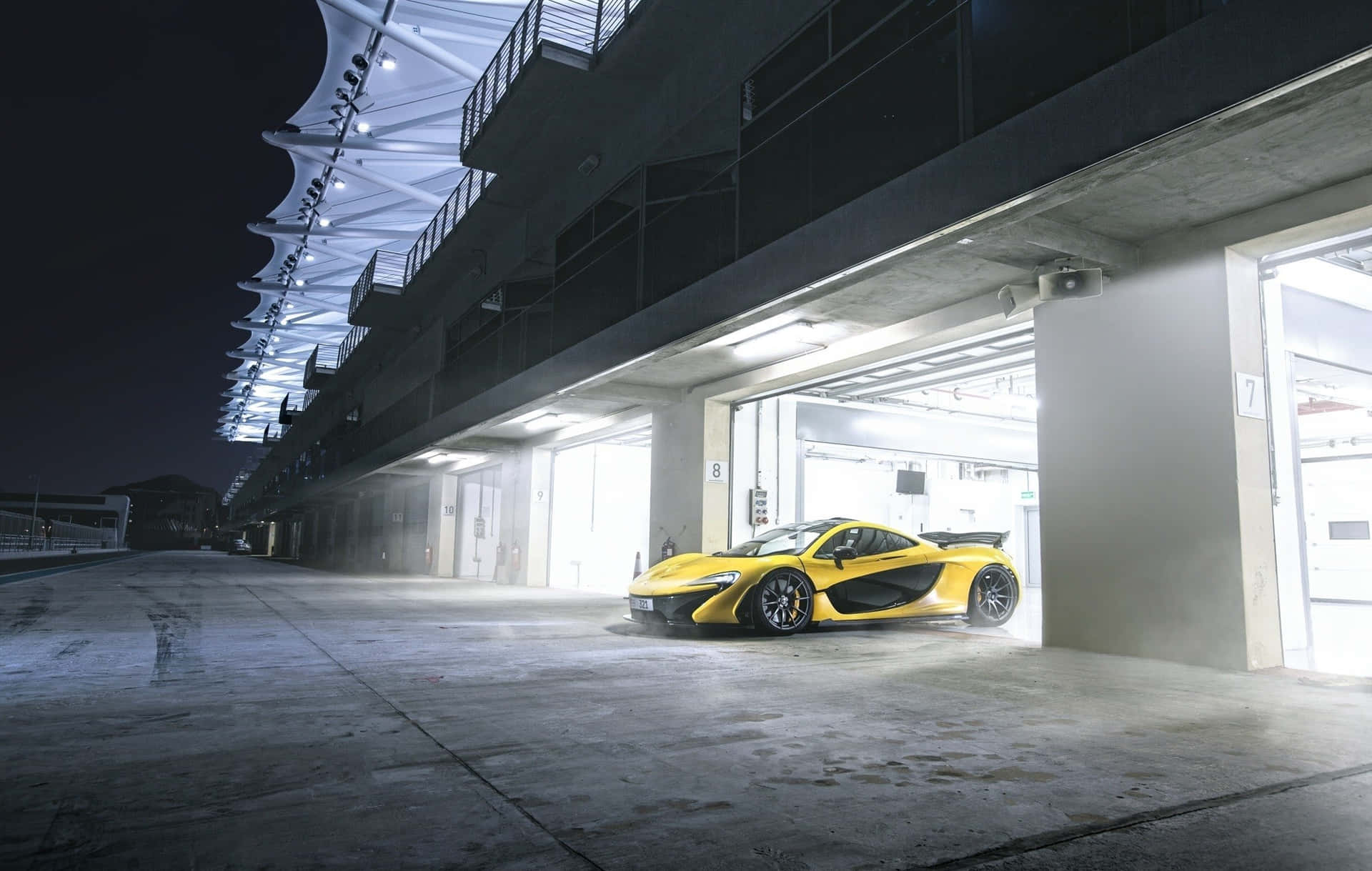 Yellow McLaren P1 Supercar Parking Lot Wallpaper