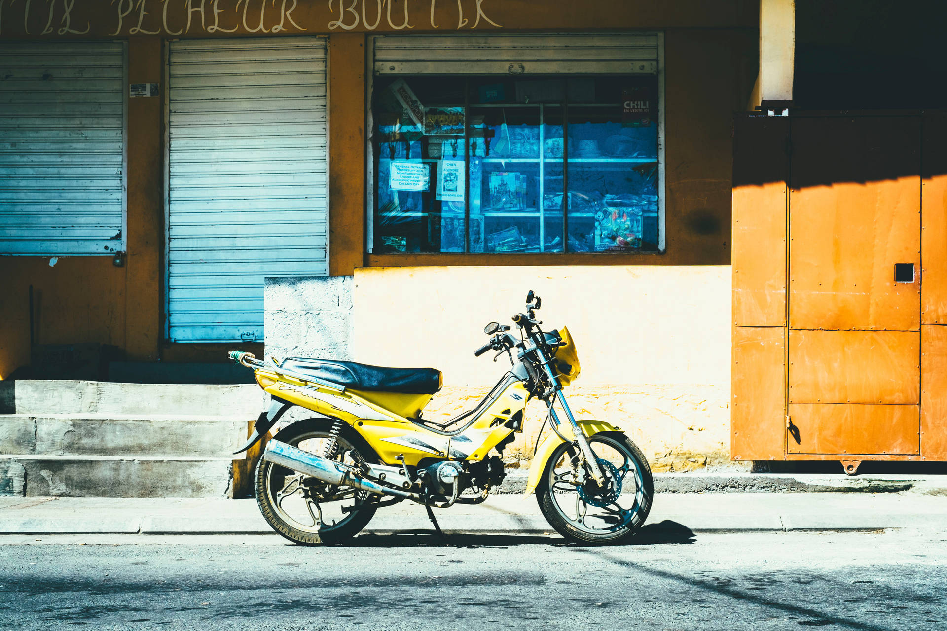 Yellow Motorcycle Near Store Wallpaper