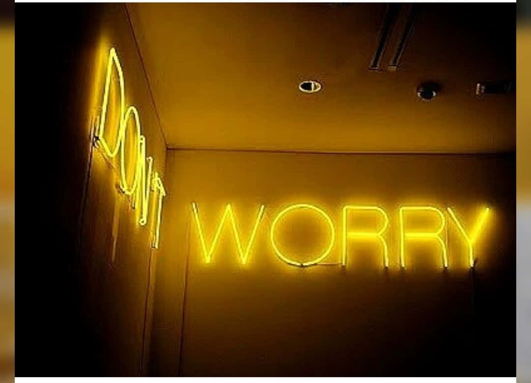 Neon Sign With The Words Don't Worry Wallpaper